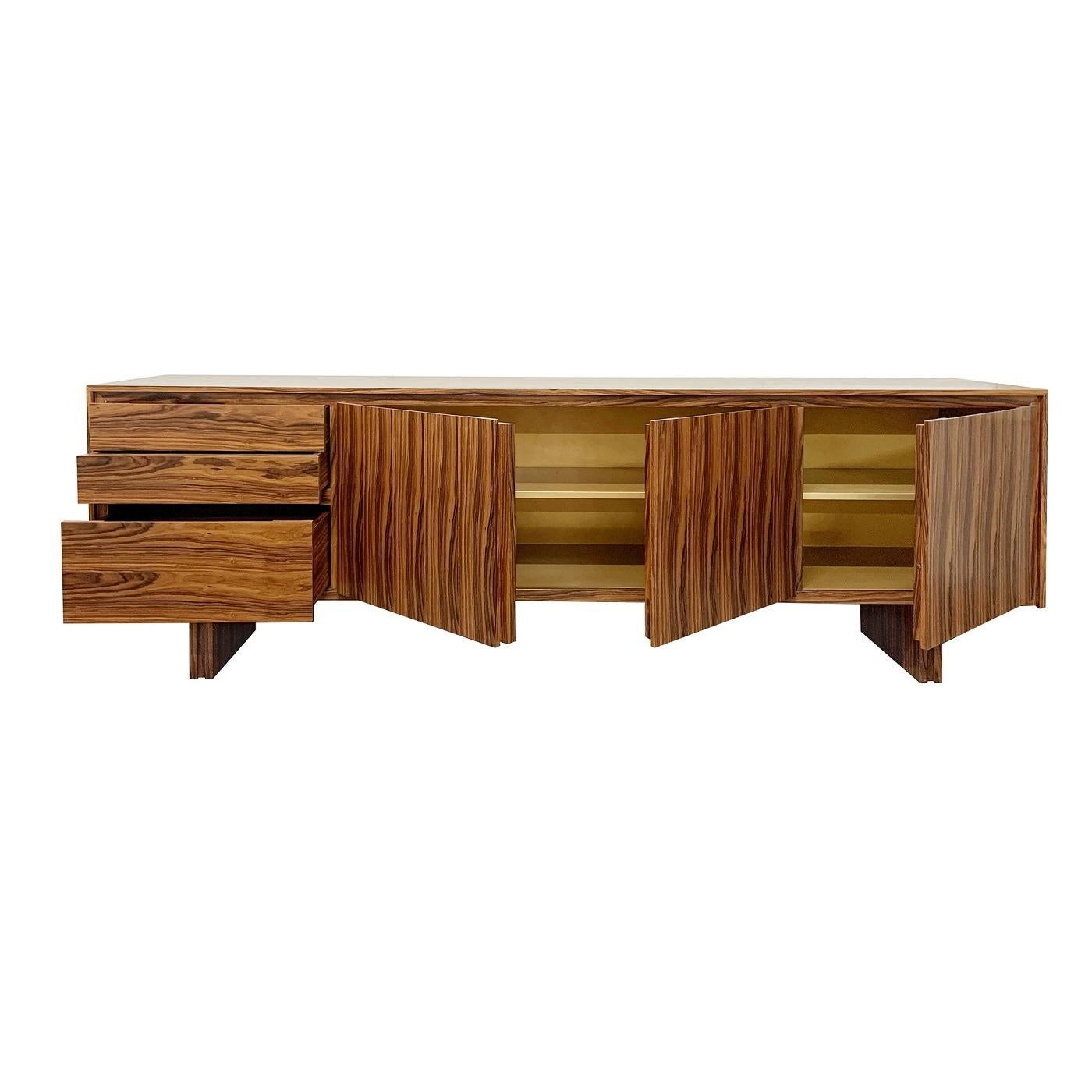 With its rigorous lines and natural wood tones, this exclusive sideboard is a stylish addition to any space. The solid honeycomb wooden frame is veneered in prized rosewood to add a warming and dynamic touch to its contemporary look, while two