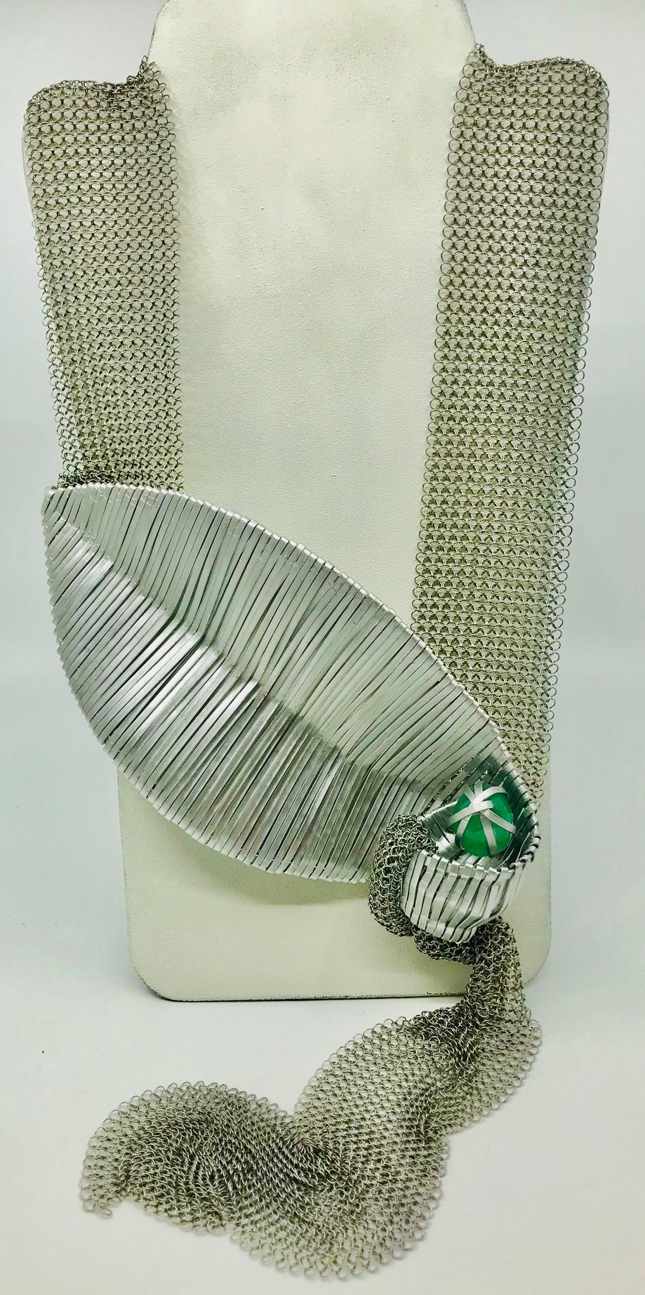  Emerald Pendant on Stainless steel mesh, consists of  around 80 carat Emerald cabochon in an aluminum hand crafted cage on Stainless steel chainmail. This creation in collaboration with well known Croatian sculptor  can be worn as a long necklace