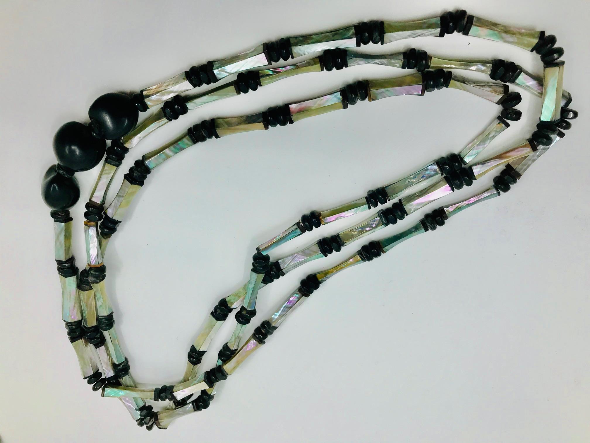  Long 3 strand Necklace with  up-cycled turquoise Art Deco Abalone beads. The beads are exquisitely hand crafted from thin Abalone /Haliotis hand cut pieces with black bone ends.The long Necklace spacers are  small wooden beads . As an accent it has
