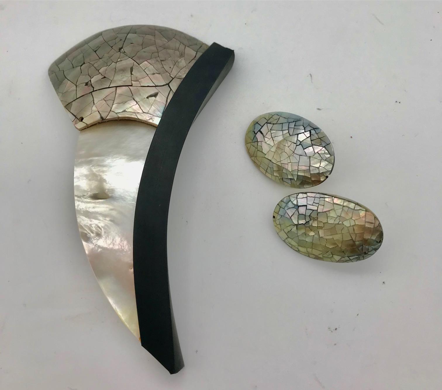  White Mother of Pearl /Abalone Brooch with matching earrings.The brooch consists of top quality white mop and beautiful Abalone fastened with black rubber channel. The clasp is magnetic.The earrings are matching Abalone in oval shape with with clip