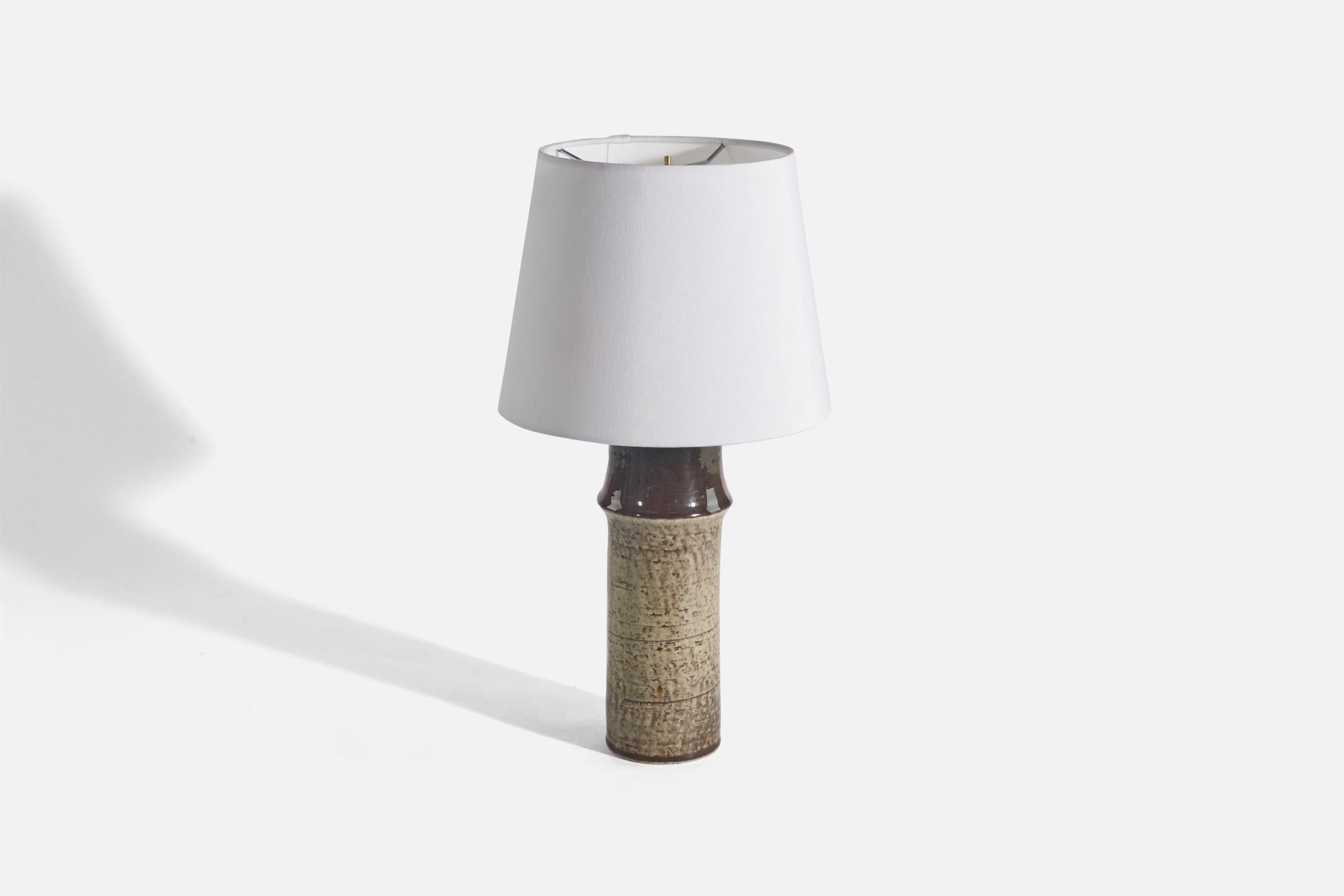 A brown and beige stoneware table lamp, 