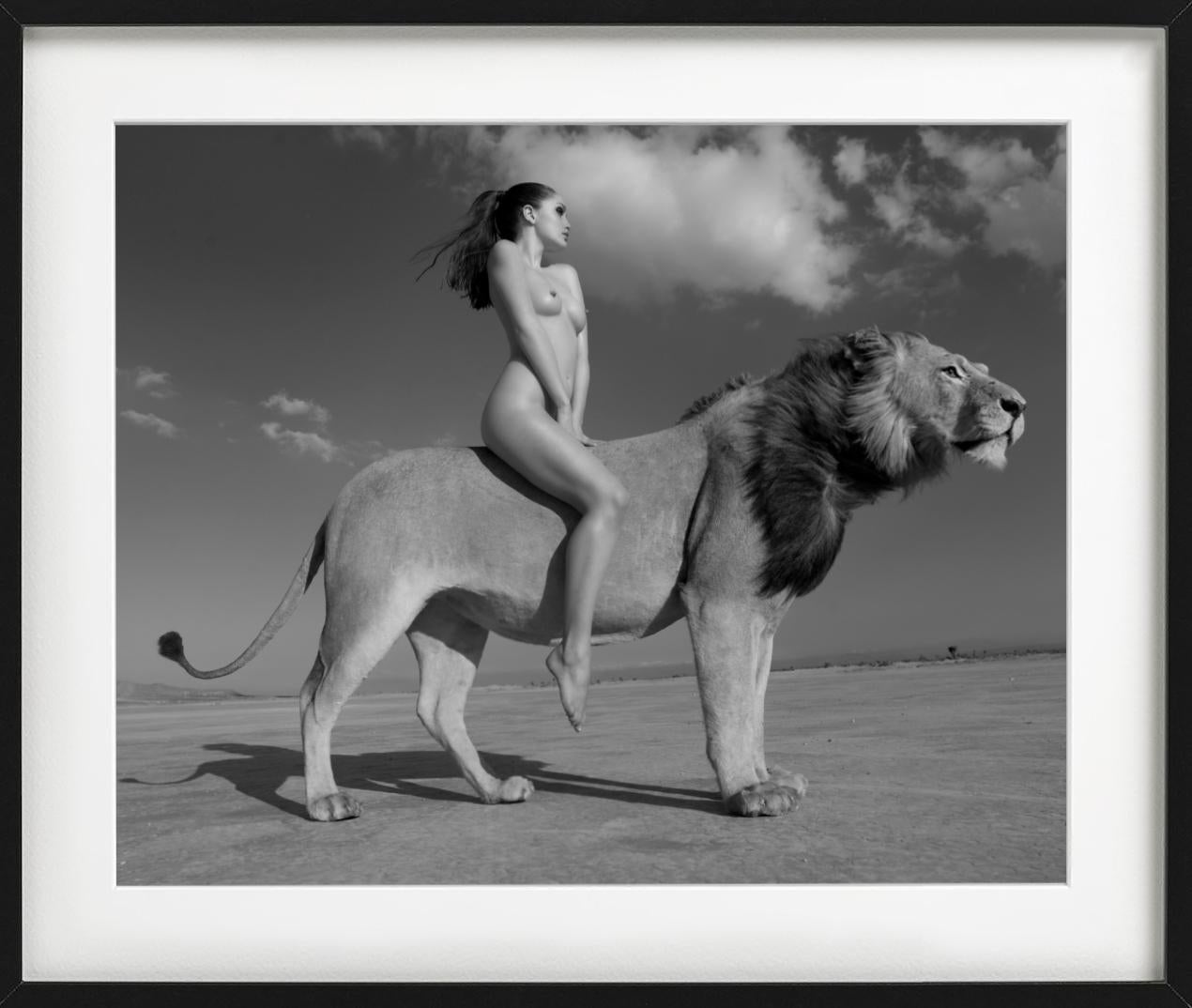 Angela rides the lion -  nude with lion in the desert, fine art photography 2008 - Contemporary Photograph by Sylvie Blum