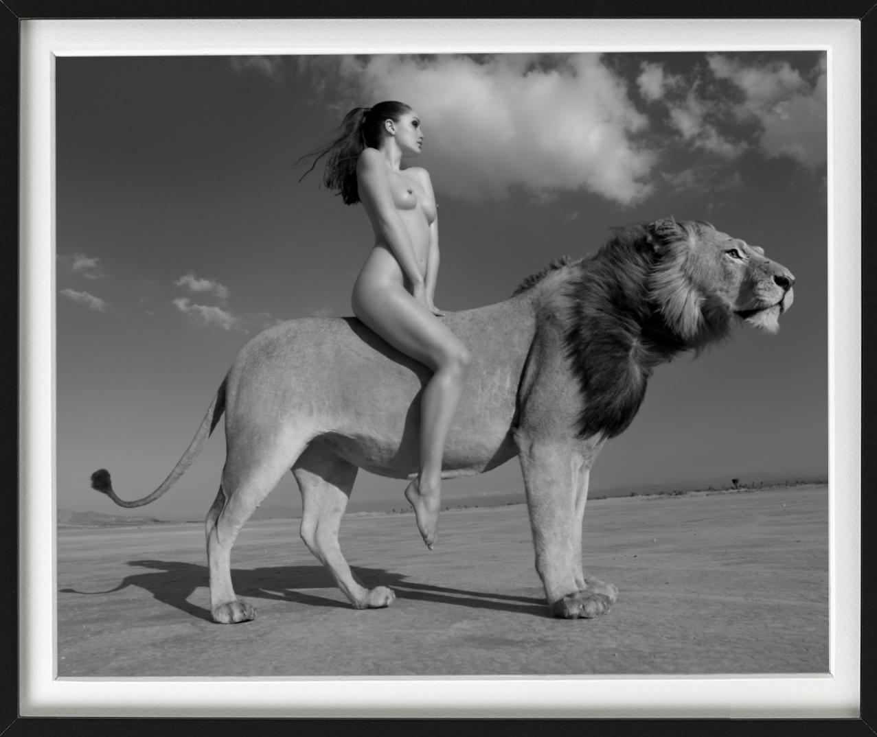 Angela rides the lion -  nude with lion in the desert, fine art photography 2008 - Gray Nude Photograph by Sylvie Blum