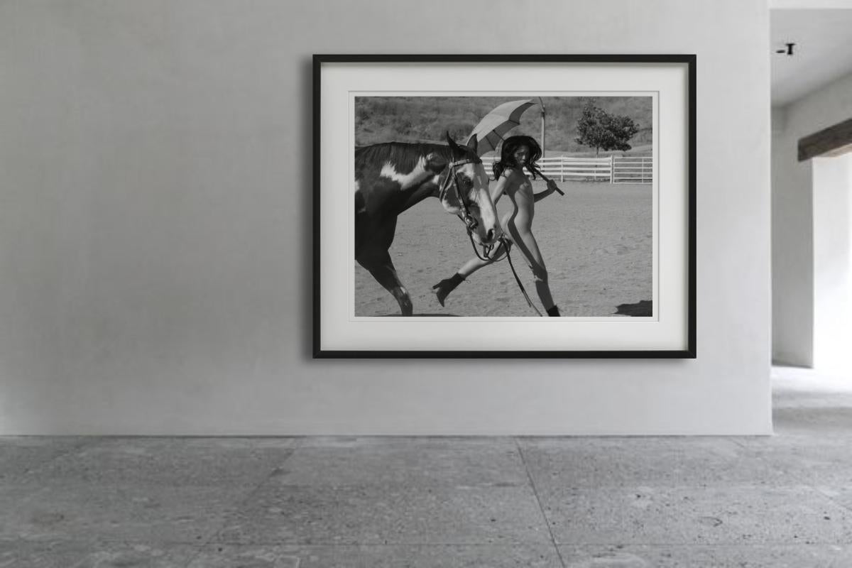 From Sylvie Blum´s well-known horses series, a woman walking a horse and holding an umbrella, photographed by Sylvie Blum.

All prints are limited edition. Available in multiple sizes. High-end framing on request.

All prints are done and signed by