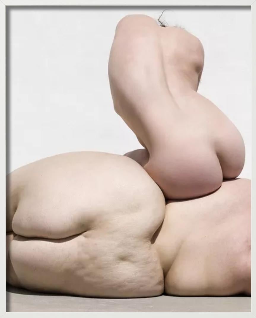 Three women sitting on each other, forming a human rock with their bodies photographed by Sylvie Blum.

All prints are limited edition. Available in multiple sizes. High-end framing on request.

All prints are done and signed by the artist. The