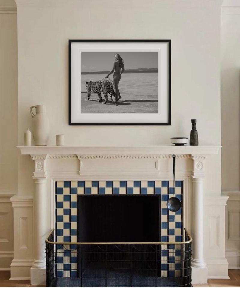 A Woman walking a tigress, black and white, photographed by Sylvie Blum in 2008.

All prints are limited edition. Available in multiple sizes. High-end framing on request.

All prints are done and signed by the artist. The collector receives an