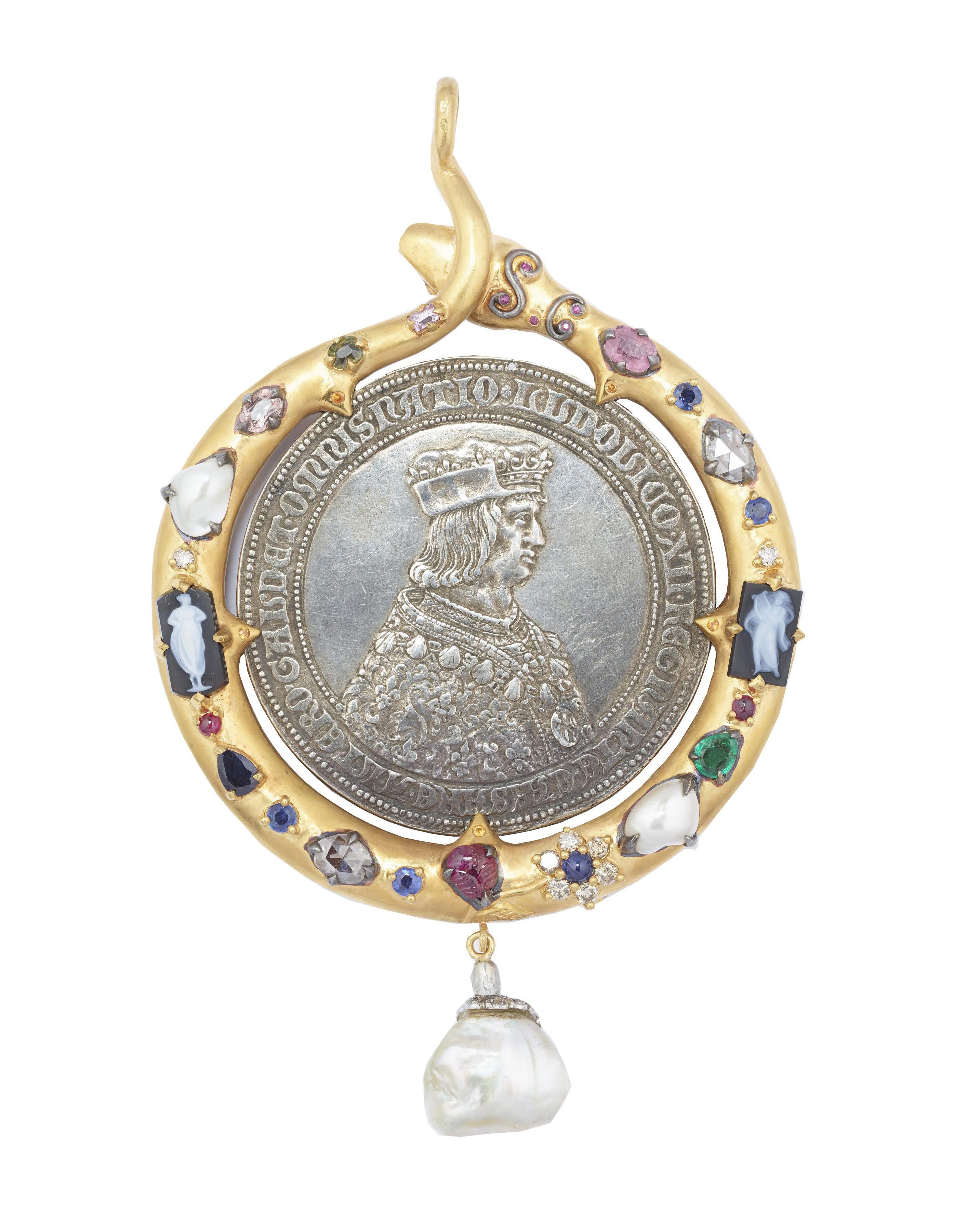 One of a kind snake pendant in 18K Gold and Vermeil. The snake is doube sided and each side is set with old mine rubies, old mine carved sapphires, old mine rose cut diamonds and XIX century onyx cameos. In the center of the snake frame you find a