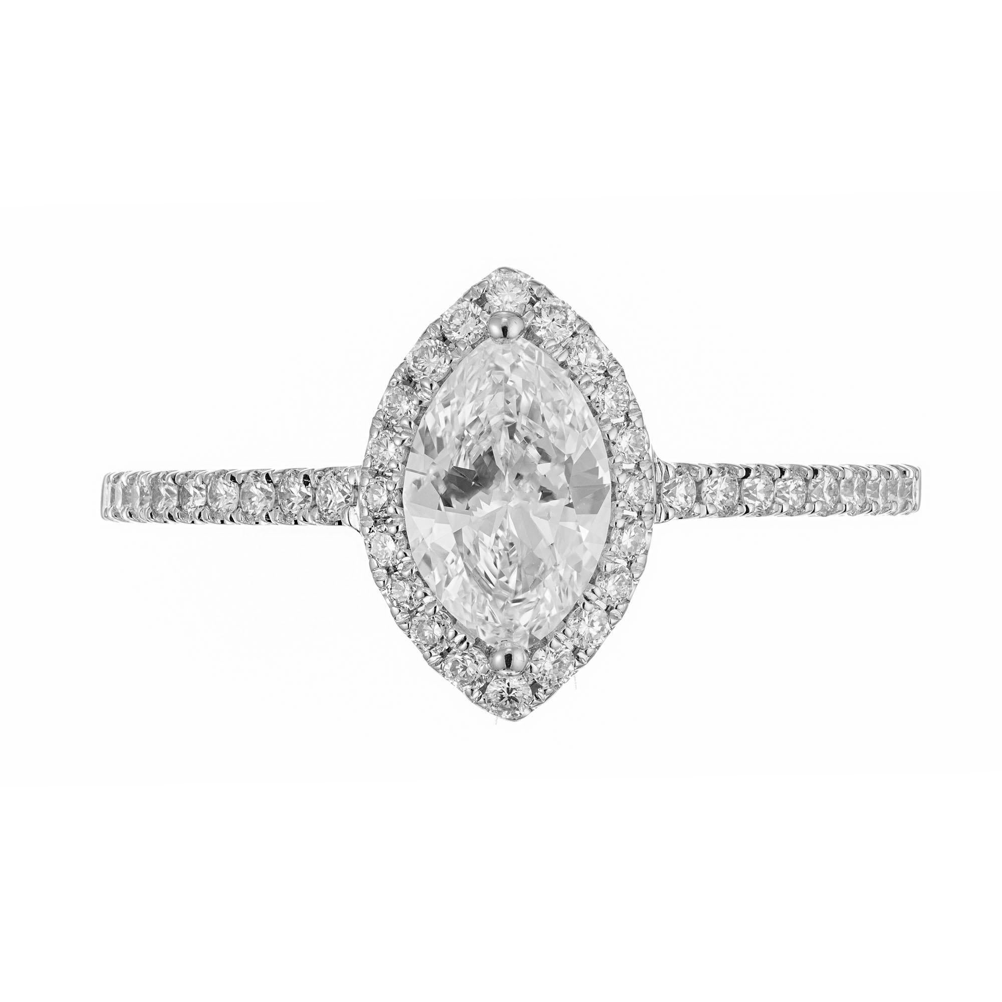 Sylvie Marquise diamond engagement ring. EGL certified marquise center diamond, set in a 14k white gold setting with a halo of full cut diamonds with accent diamonds along each side of the shank. Designed so that a wedding band can sit flush against