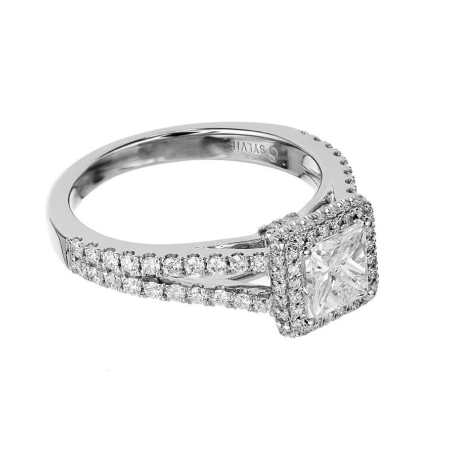 Discover elegance redefined with the Sylvie GIA certified .74ct diamond halo gold split shank engagement ring. This breathtaking piece is a masterpiece of timeless beauty and modern sophistication. At its heart lies a dazzling .74 carat princess cut