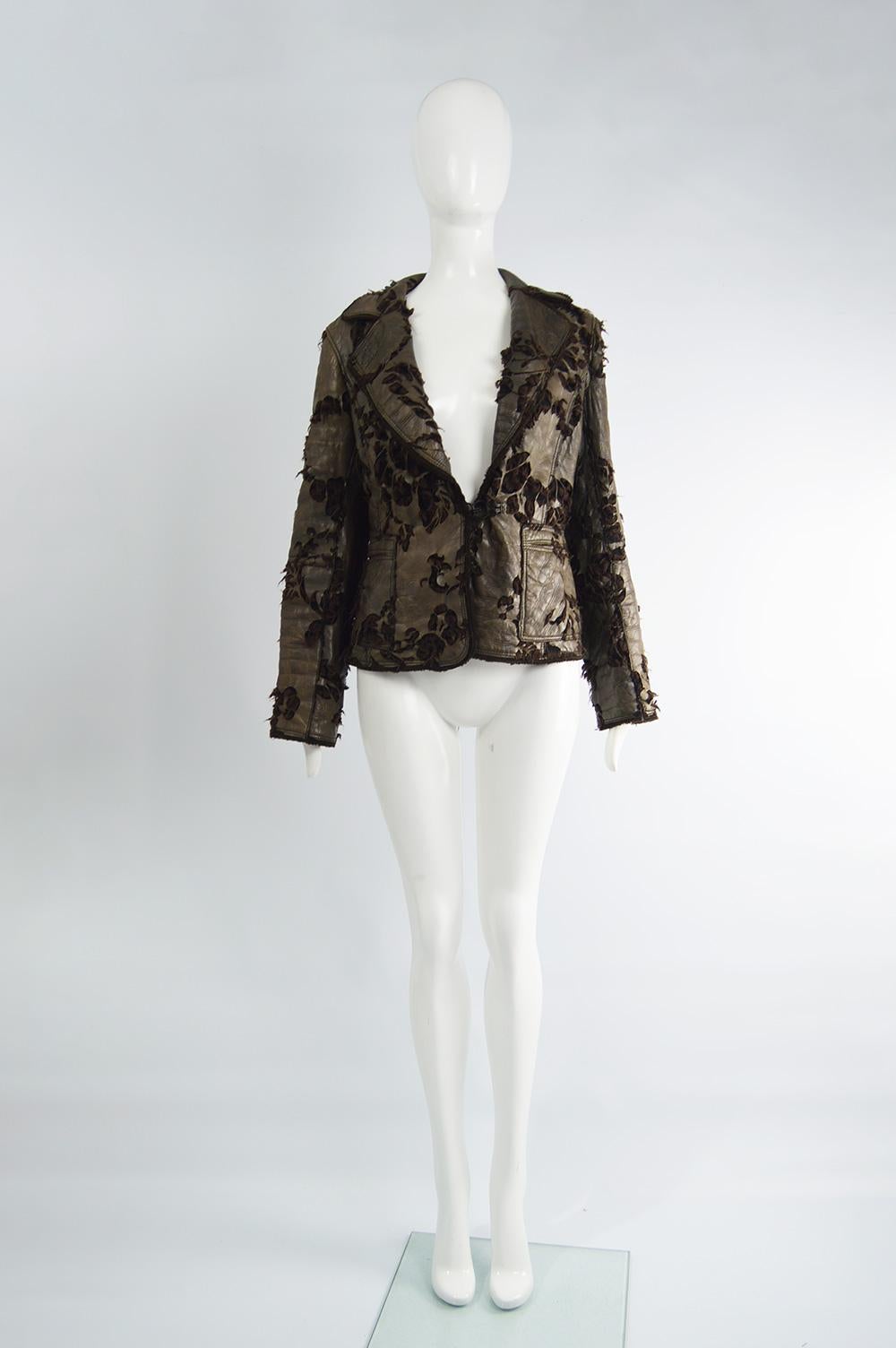 An incredible womens jacket by luxury French fashion designer Sylvie Schimmel Paris. In a lightweight brown lambskin leather with a vintaged effect, floral cut outs which light sheeps shearling comes out of to create a deconstructed look and a wool