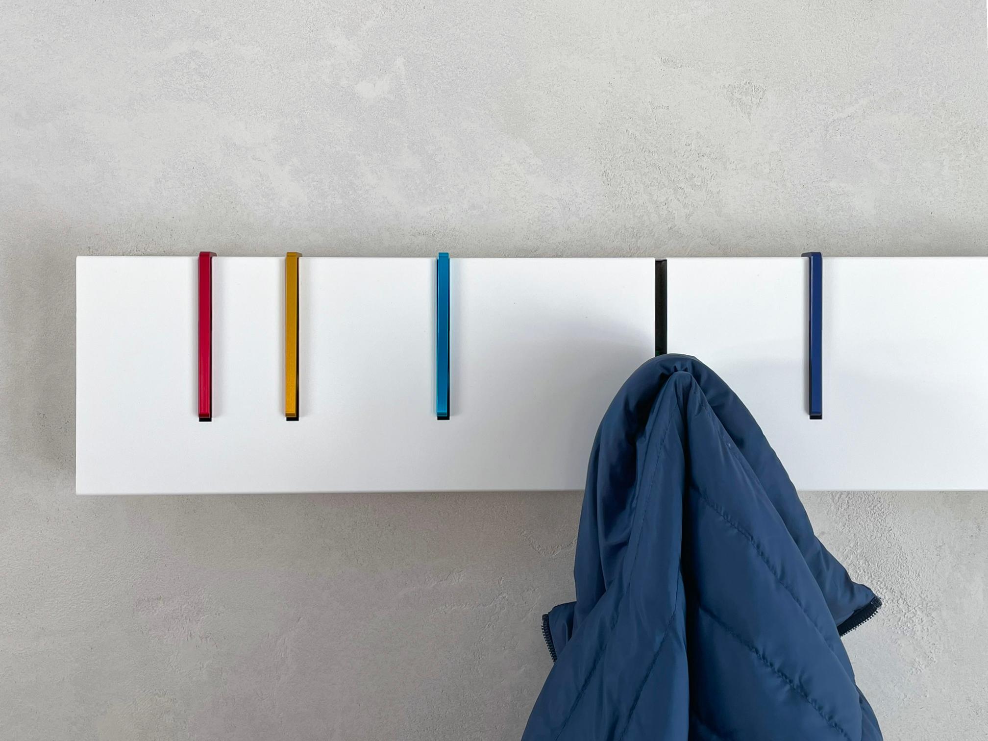 The iconic coat rack that functions as both a practical storage solution and modern sculptural object. When not in use as a coat rack, the Symbol hangs on the wall as a purely aesthetic piece. When needed, the precision machined metal coat hooks