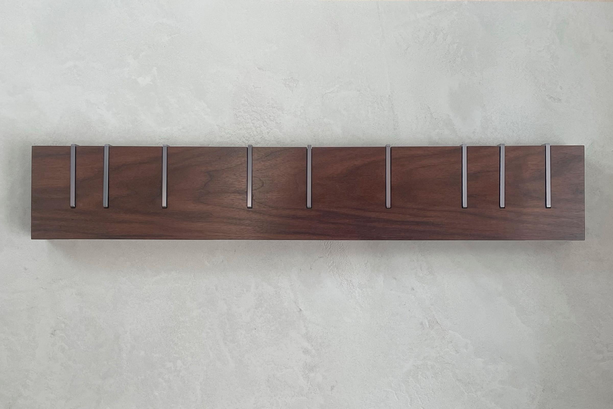 Symbol X is an ongoing exploration into rendering our iconic symbol coat rack in new materials and finishes. With limited, small batch productions each unit is one of a kind. The photos on this page are of the exact coat rack you will receive,