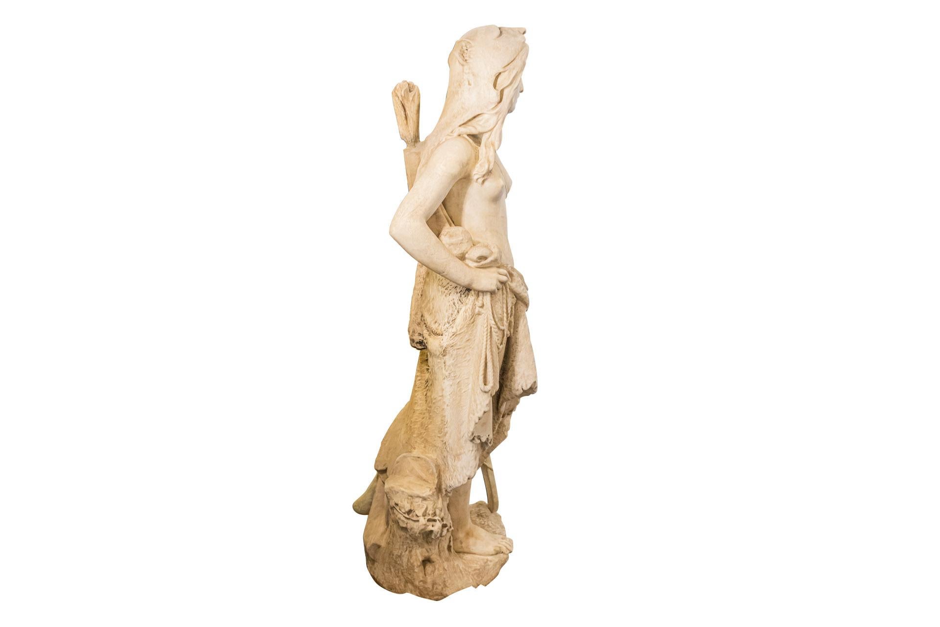 Symbolist interpretation of Artemis,
Representing a woman dressed in a loincloth and carrying a quiver, a bow in one hand and a rope in the other, as well as an animal skin,
The torso is represented naked, the eyes are open and the mouth