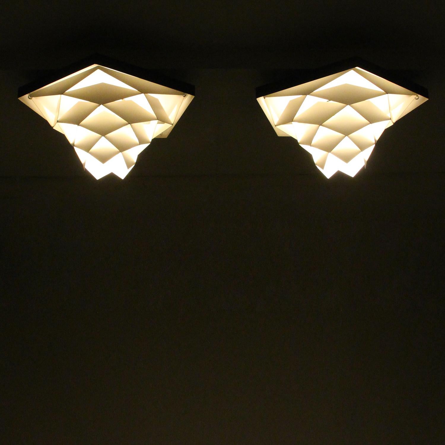 Symfoni Flush, pair of ceiling flush lights by Preben Dal in the early 1960s and produced by H. Følsgaard Elektro - extremely rare pair of Danish white and gray ceiling flush lights in very good vintage condition!

A pair of enchanting