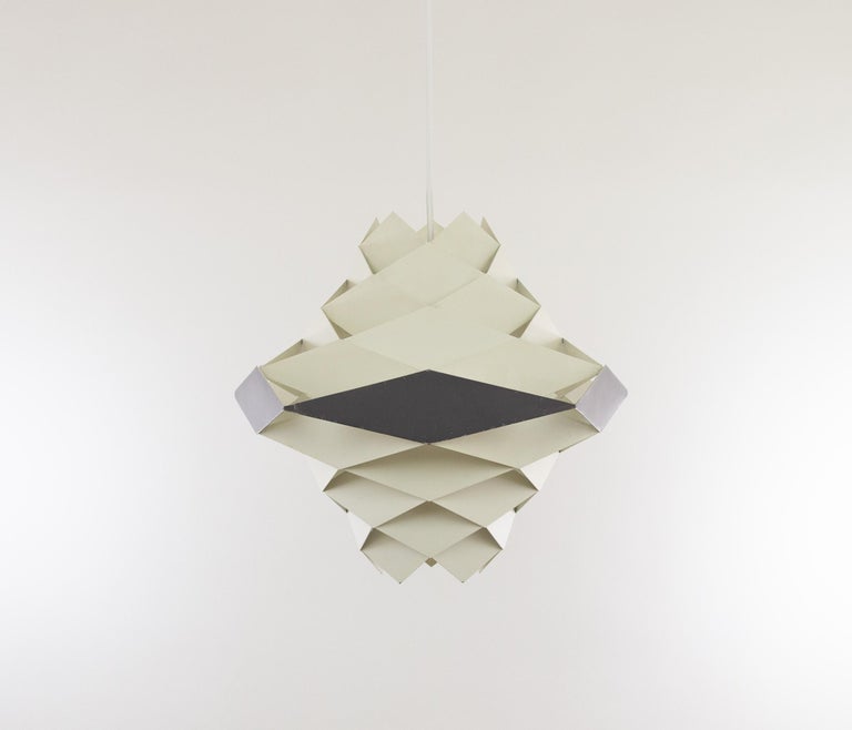 Symfoni pendant designed by Preben Dahl in the 1960s and produced by lighting manufacturer Hans Følsgaard Belysning.

The lamp is part of the Symfoni lighting series, consisting of ceiling lights and pendants made of white and grey-lacquered metal