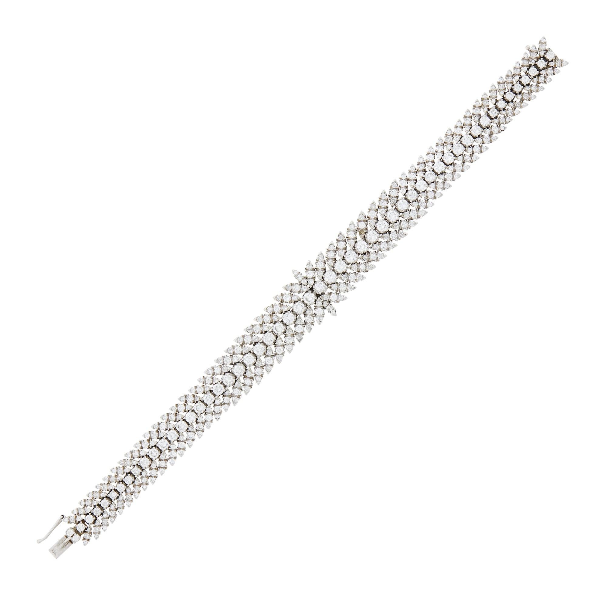 This bracelet features an astonishing 372 round diamonds, 54 weighing approximately 4.45 carats and 318 weighing approximately 5.30 carats, all meticulously set in 18K white Gold. 