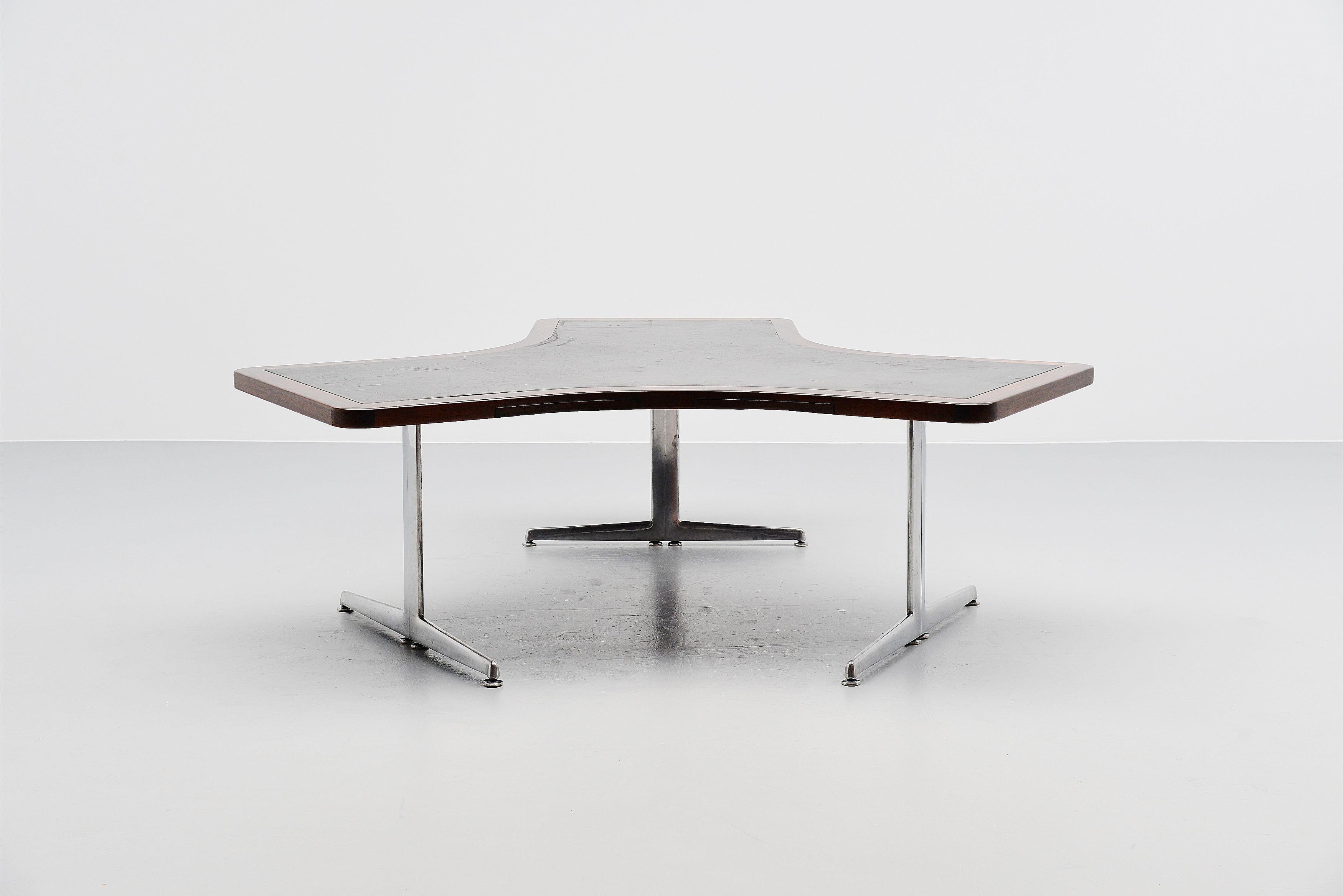Very nice and unusual shaped symmetrical conference desk table, Denmark 1965. The table has a very nice shape and has a rosewood edge with black leather inlayed top. The base is made of aluminium, polished. Very nice shaped high quality desk table,