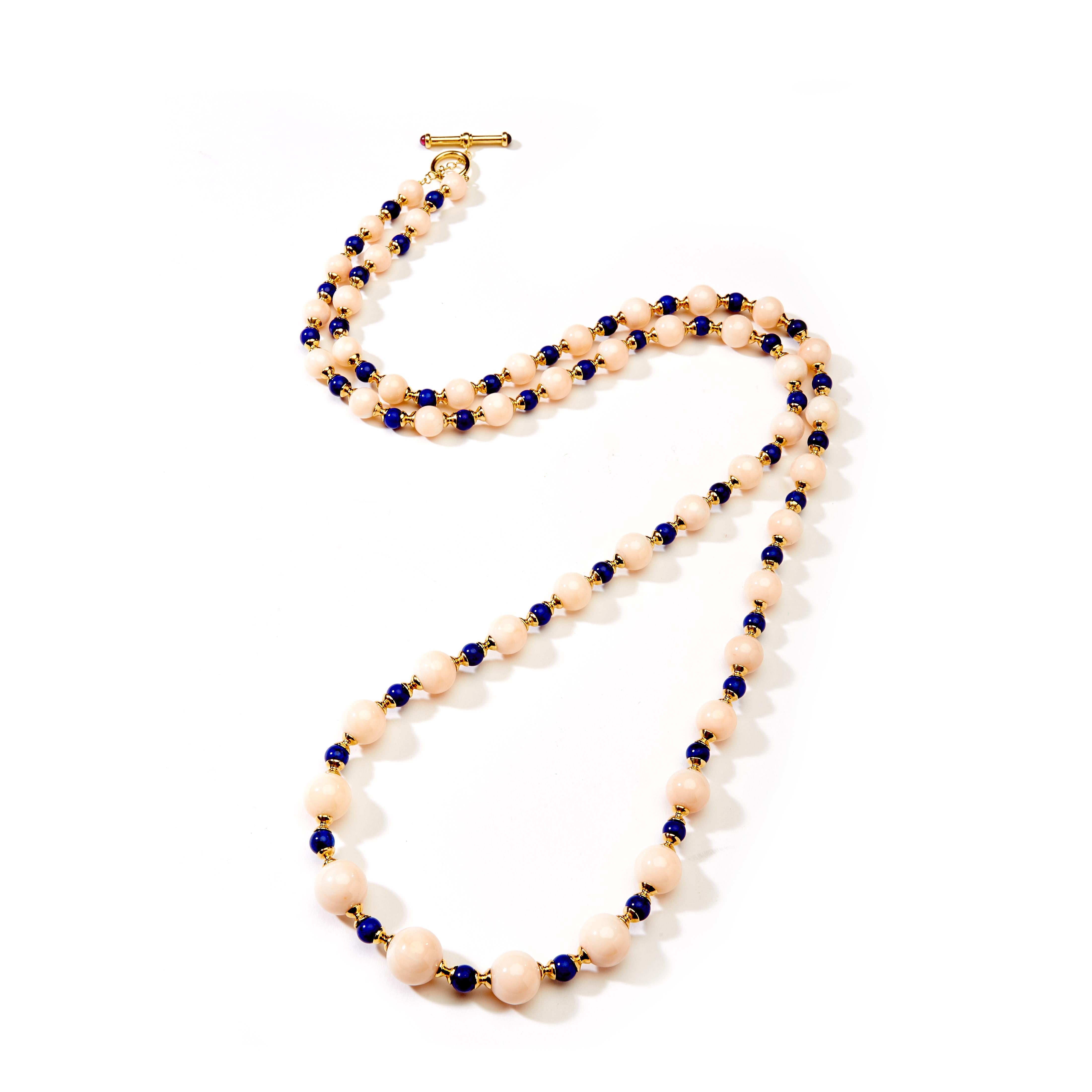 Created in 18 karat yellow gold
Angel Skin Coral gemstone beads 210 carats approx.
Lapis Lazuli gemstone beads 47 carats approx.
25 inches long, strung on silk
18 karat yellow gold hourglass roundels
18 karat large toggle clasp with rubellite
One of