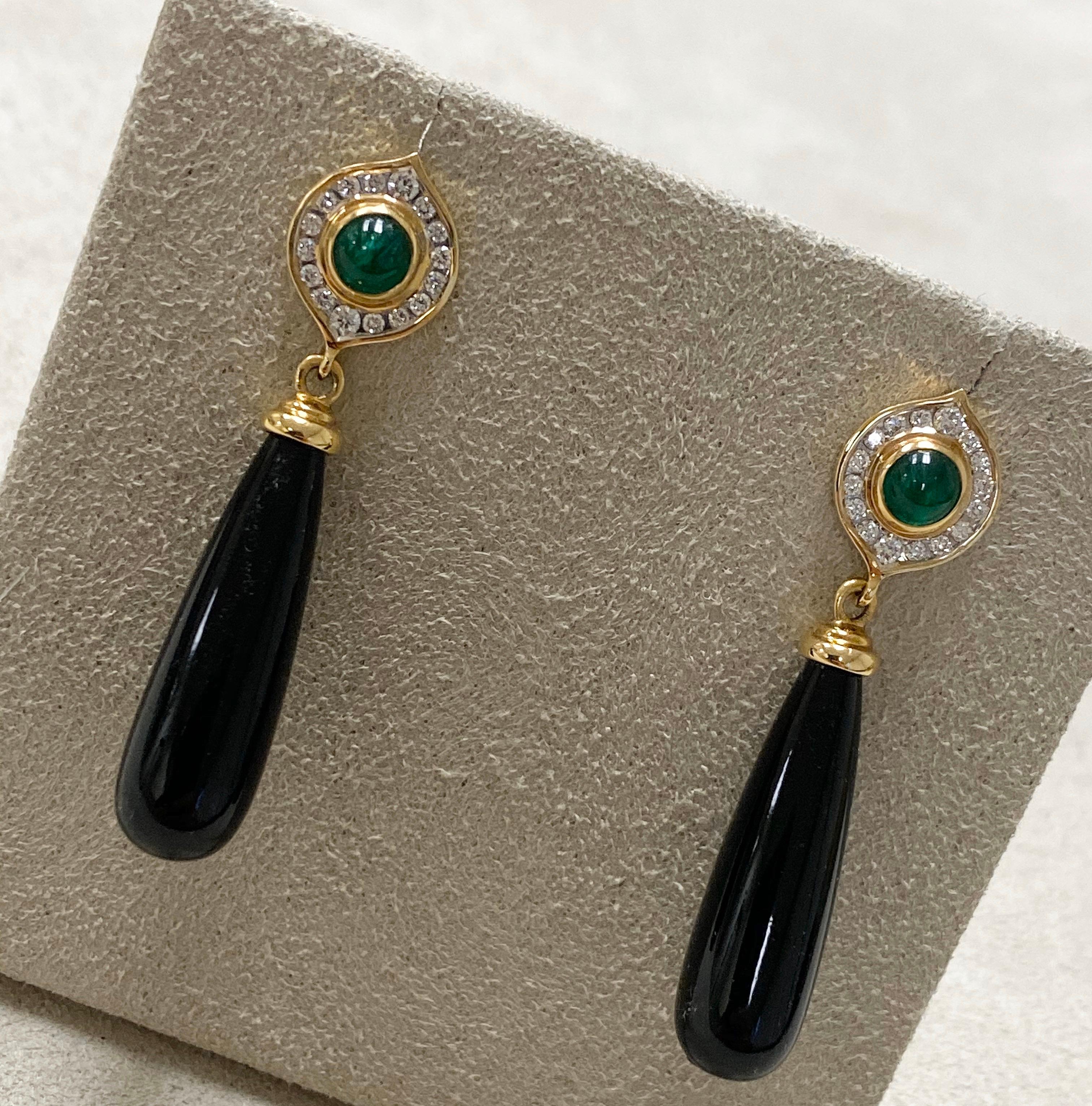 Created in 18 karat yellow gold
Black onyx 33 cts approx
Emeralds 0.70 ct approx
Diamonds 0.30 ct approx
Limited edition

Adorn yourself with these exquisitely crafted Candy Blue Topaz & Diamond earrings set in 18k yellow gold and featuring black