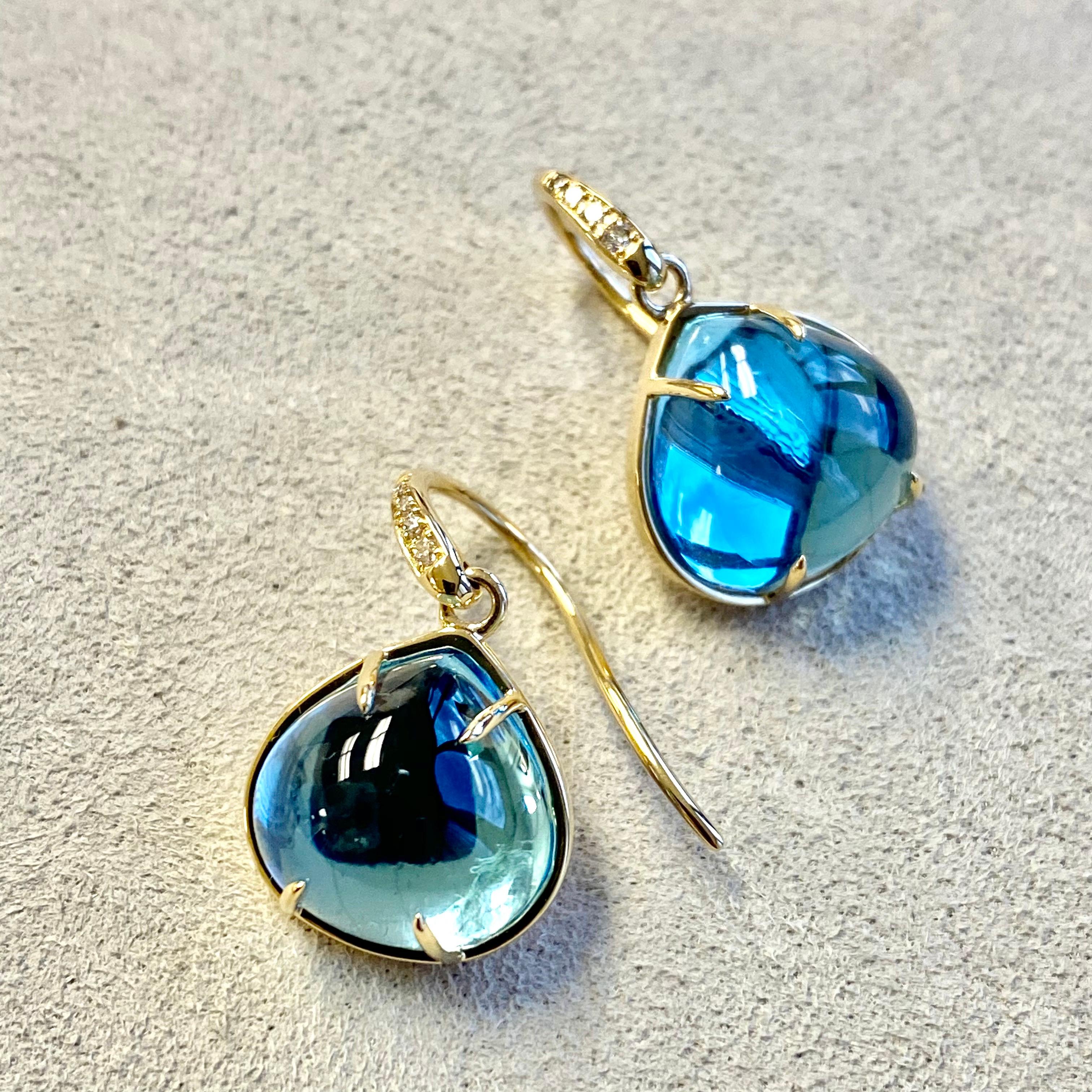 Erstellt in 18kyg
Blautopas ca. 15 Karat.
Diamanten ca. 0.05 Karat.
Limitierte Auflage

Diese eleganten und geschmackvollen Ohrringe, die in limitierter Auflage hergestellt werden, sind ein echter Hingucker. Die luxuriöse Kombination aus