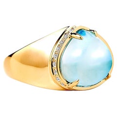 Syna Bague en or jaune et topaze bleue avec diamants champagne