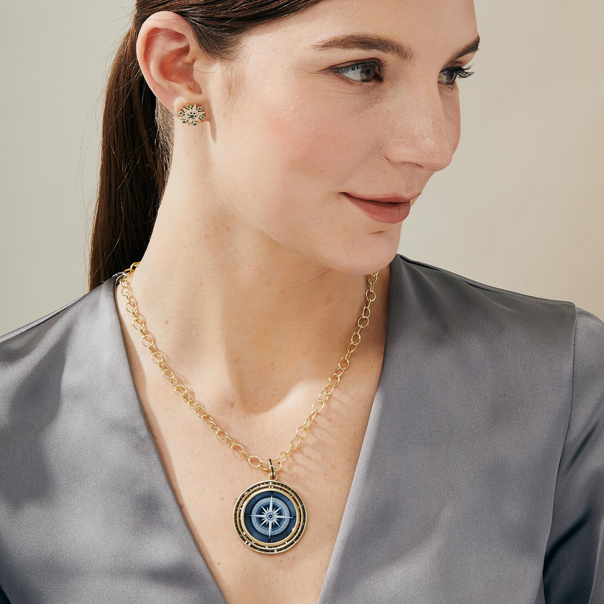 Created in 18 karat yellow gold
German laser carved compass shell cameo
Black diamonds 2 cts approx
Limited edition

Crafted from luxurious 18 karat yellow gold, this limited edition pendant features a German laser-carved compass shell cameo and 2