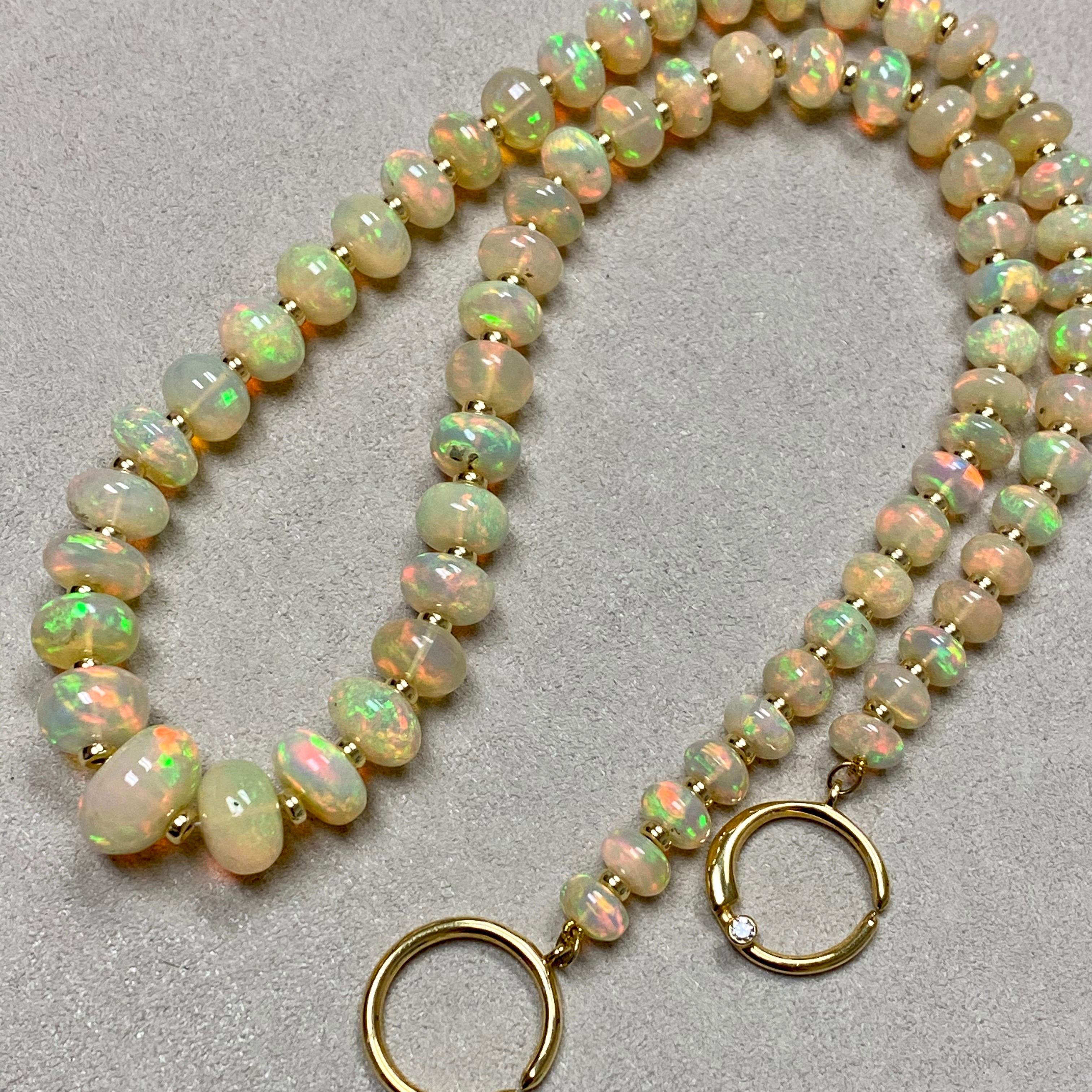 Created in 18 karat yellow gold
18 inch graduating length
Ethiopian Opal 110 carats approx
18kyg roundels 
18kyg circle clasp with diamond
Strung on silk
Limited edition

Exquisitely crafted from 18 karat yellow gold, this limited edition necklace