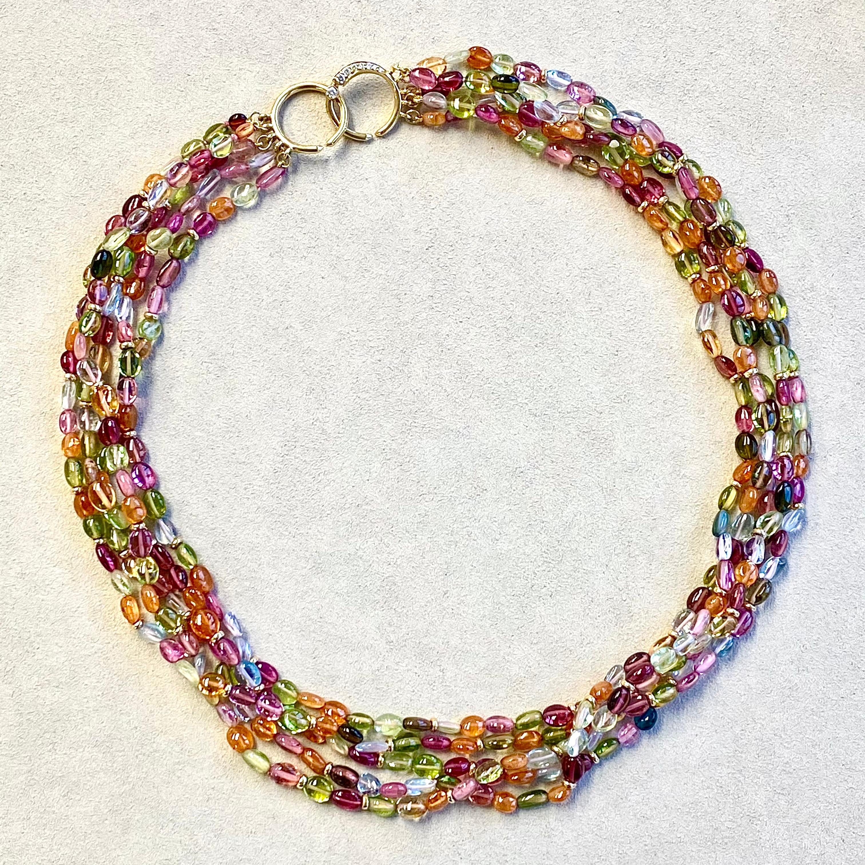 Created in 18 karat yellow gold
18 inch length
5 strands
Exotic Multi-Color Beads 300 carats approx.
18kyg roundels 
18kyg circle clasp with diamond
Strung on silk
Limited edition

Fashioned from resplendent 18-karat yellow gold, this 18-inch