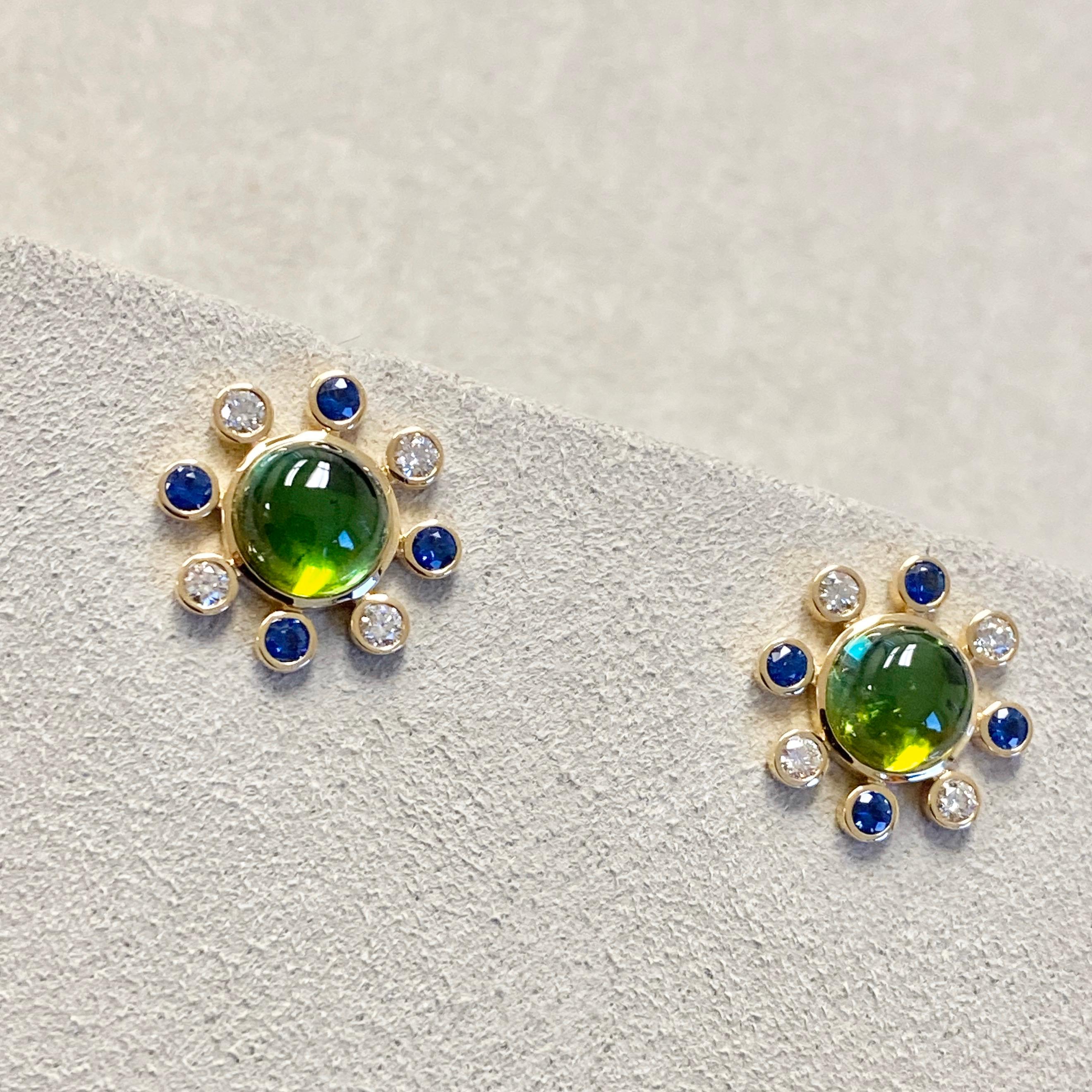 Created in 18 karat yellow gold
Green tourmaline 4 cts approx
Blue sapphire 0.50 ct approx
Diamonds 0.40 cts approx
Limited edition

Adorn your ears with these exquisite Candy Blue Topaz & Diamond earrings, crafted with 18 karat yellow gold and