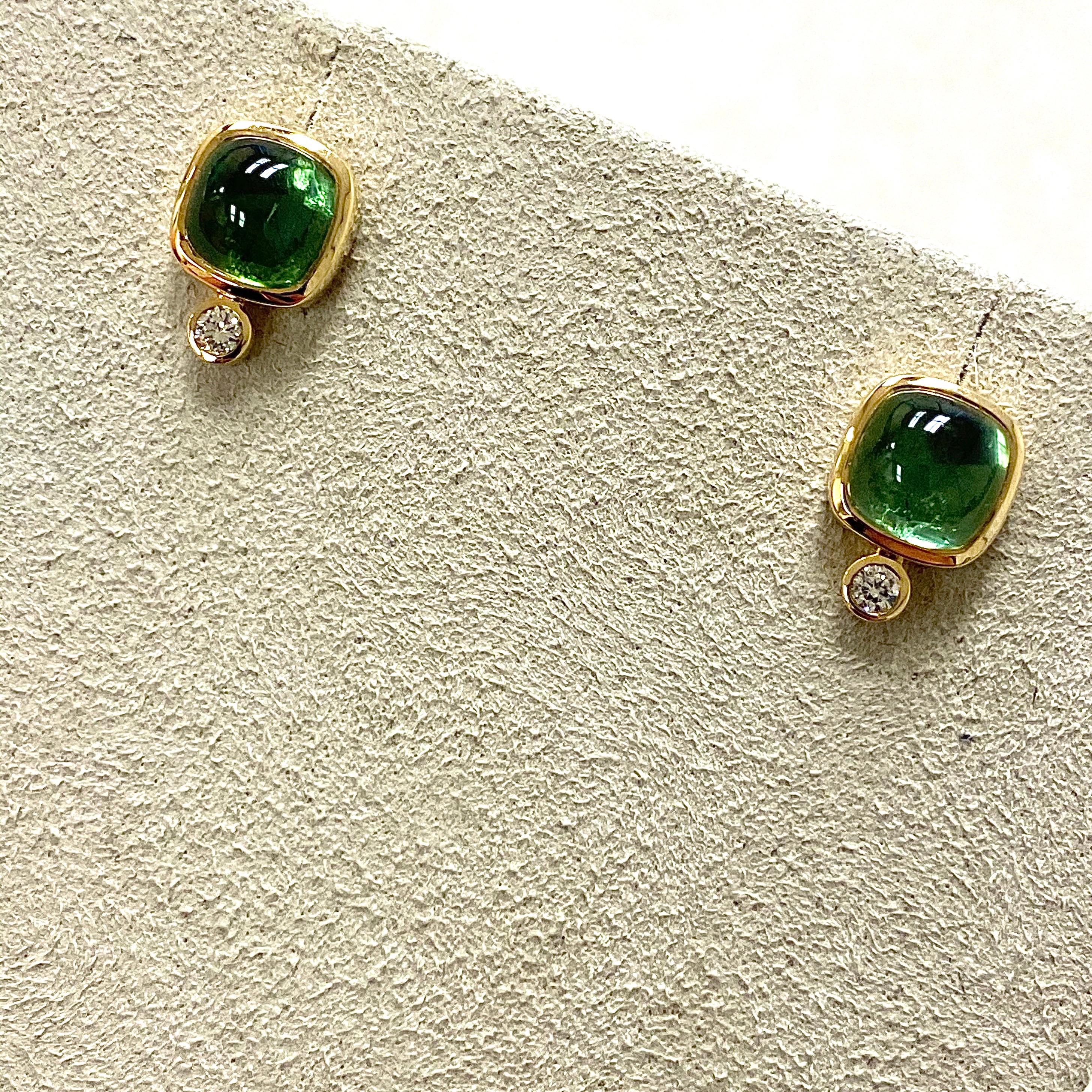 Created in 18 karat yellow gold
Green tourmaline sugarloaf cabochons 4 cts approx
Diamonds 0.10 ct approx
Limited edition

Unveil your glamorous side in this exclusive, limited edition pair of Candy Blue Topaz & Diamond earrings, lovingly crafted