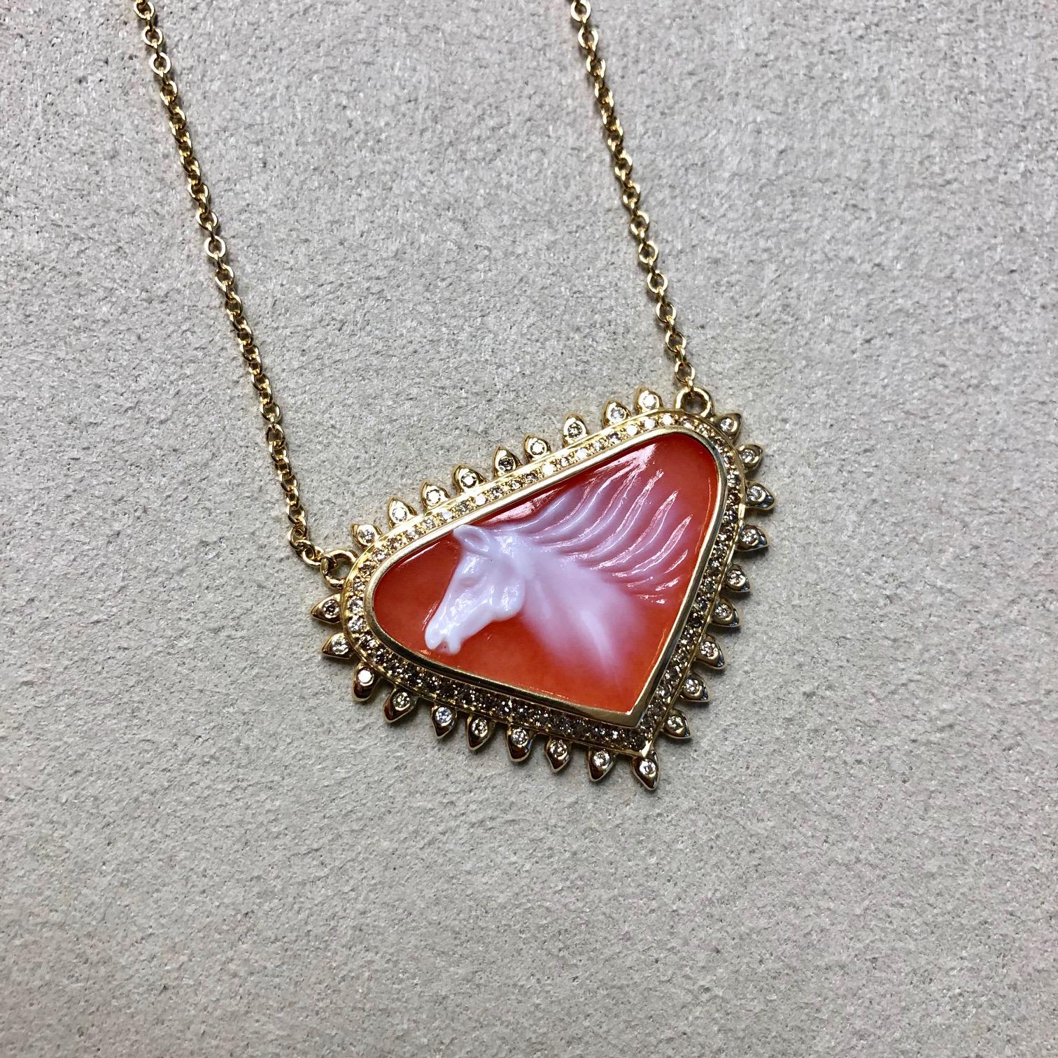 Created in 18 karat yellow gold 
Hand carved carnelian horse carving 14 cts approx
Carnelian is natural & has a gorgeous orange color
Champagne diamonds 0.50 cts approx
18kyg 17.5 inch cable chain with 18kyg lobster lock
One of a kind


About the