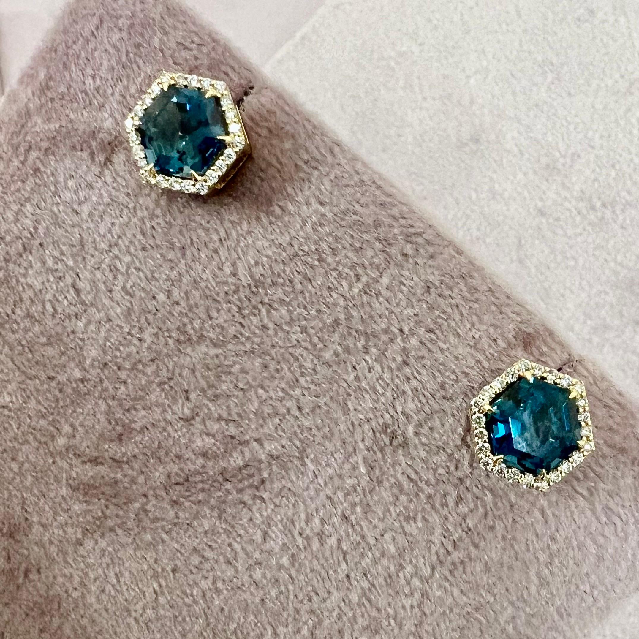 Created in 18 karat yellow gold
London blue topaz 3 carats approx.
Diamonds 0.20 carat approx.
Post backs for pierced ears
Limited Edition

Sculpted from 18 karat yellow gold, these limited edition earrings feature a languid London blue topaz—its