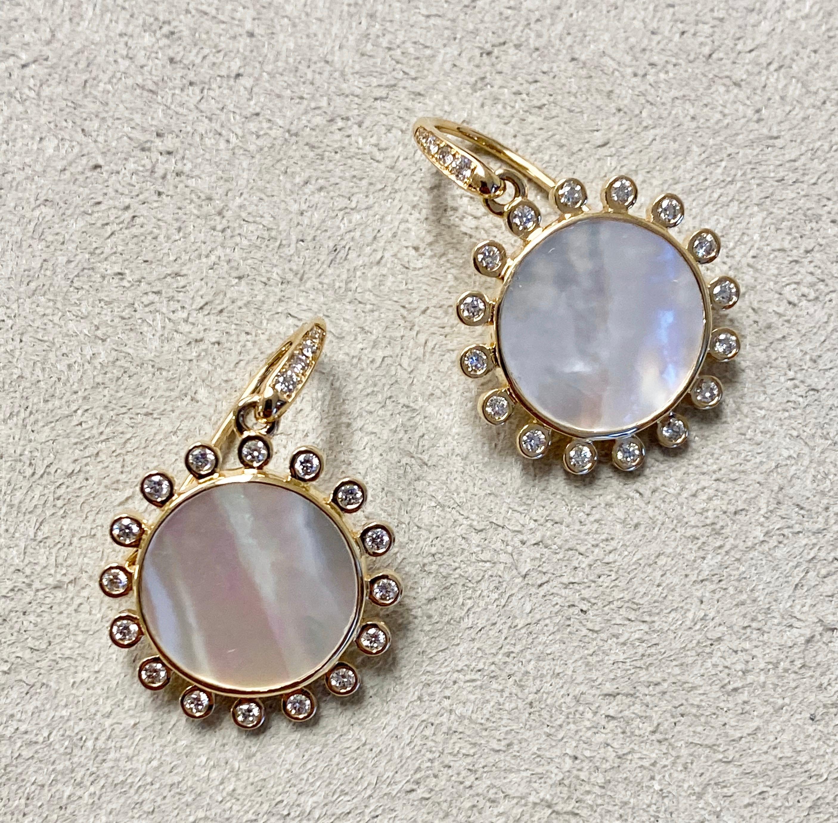Created in 18 karat yellow gold
Mother of pearl 7 cts approx
Diamonds 0.40 cts approx
Limited edition

These exquisite limited edition earrings feature dazzling candy blue topaz stones and delicate diamonds of .40 cts, housed in a luminous 18 karat