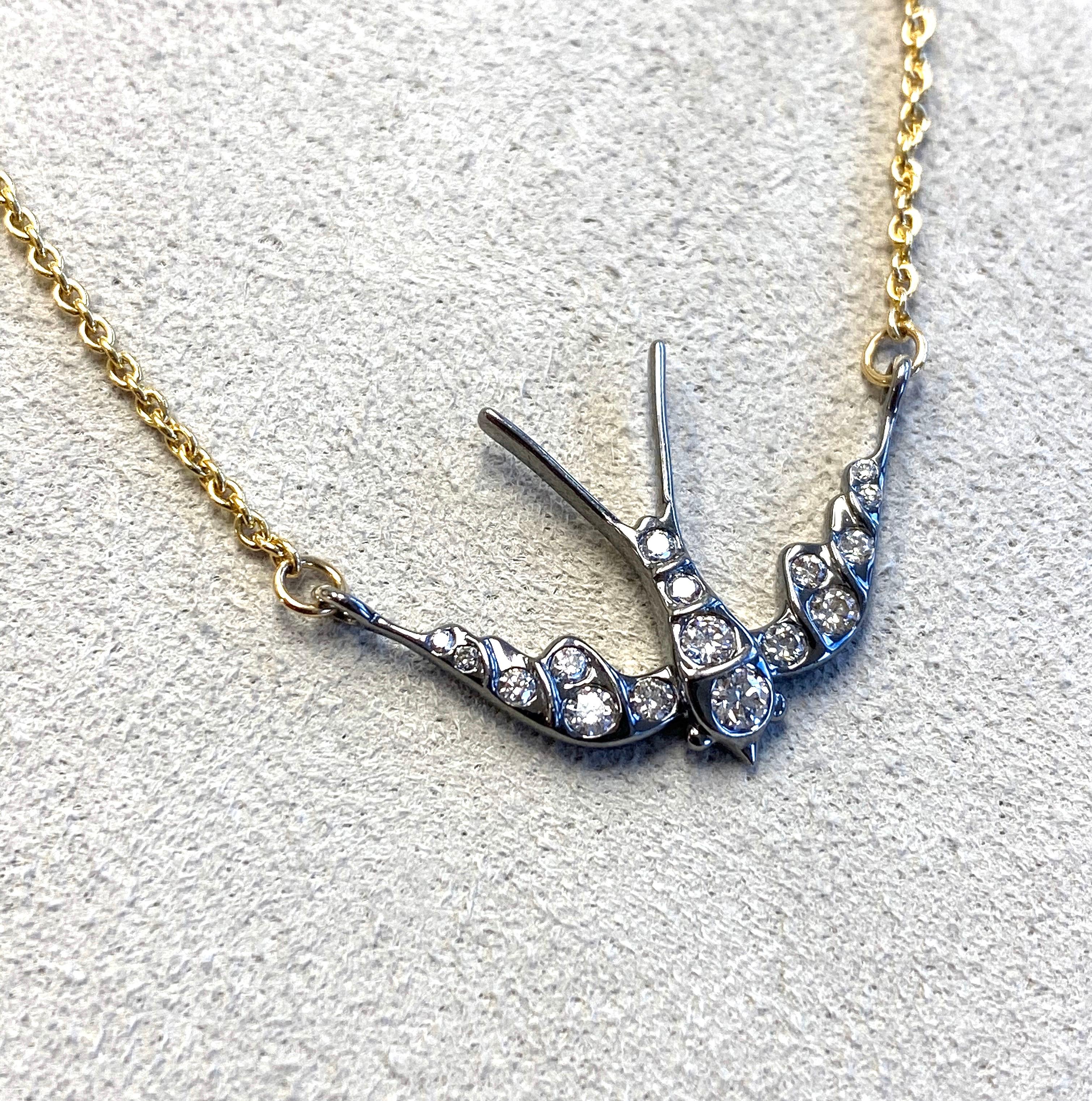 Created in 18 karat yellow gold 
Oxidized silver swallow
Diamonds 0.25 ct approx
18k yellow gold 18 inch cable chain with loops at 17 & 16 inches
Limited edition


About the Designers ~ Dharmesh & Namrata

Drawing inspiration from little things,
