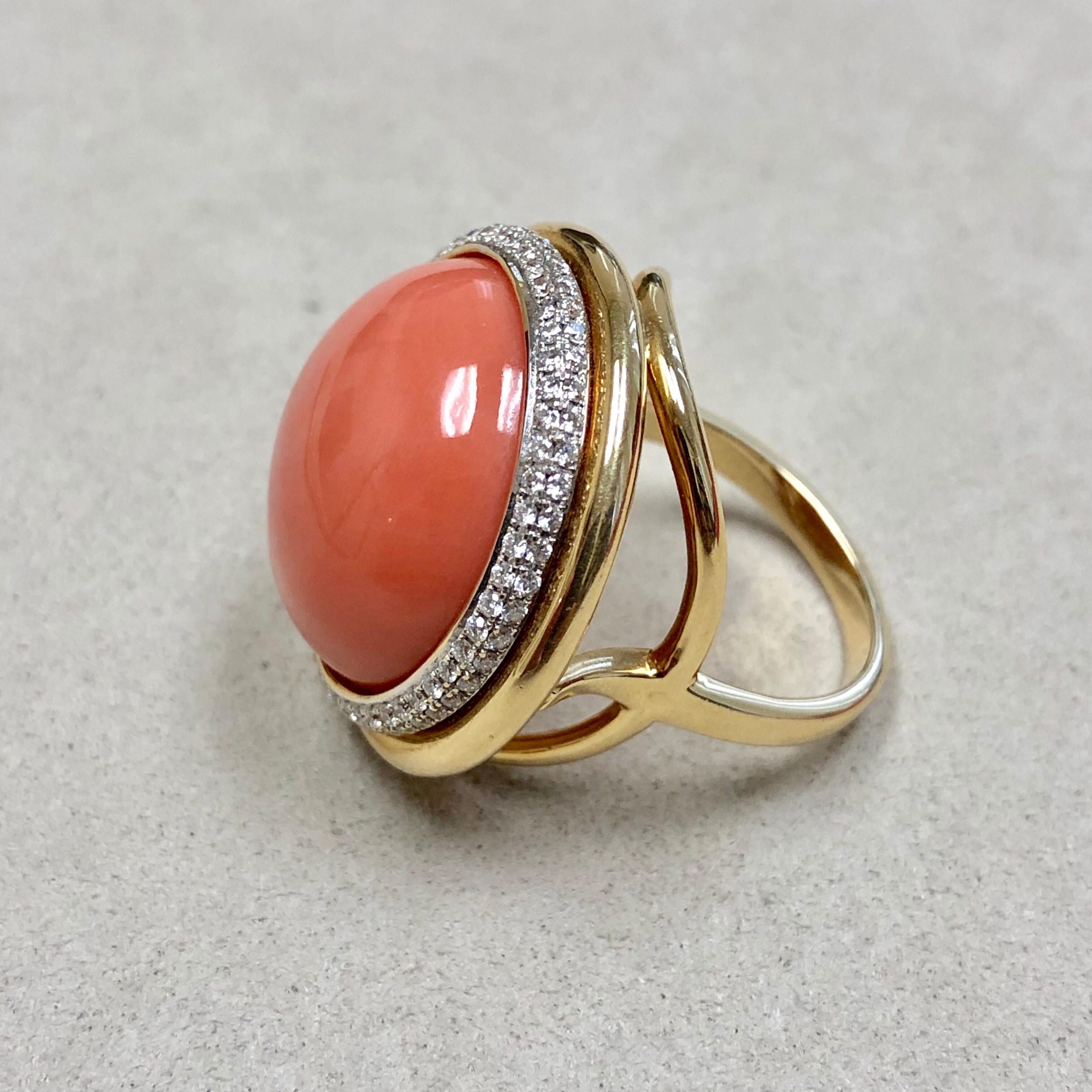Created in 18 karat yellow gold
Natural Rare Salmon Coral 20 cts approx
Diamonds 0.55 ct approx
Comfortable saddle within shank for easy fit
Ring size US 6.5, can be sized
One of a kind

Exquisitely crafted from 18 karat yellow gold, this singular