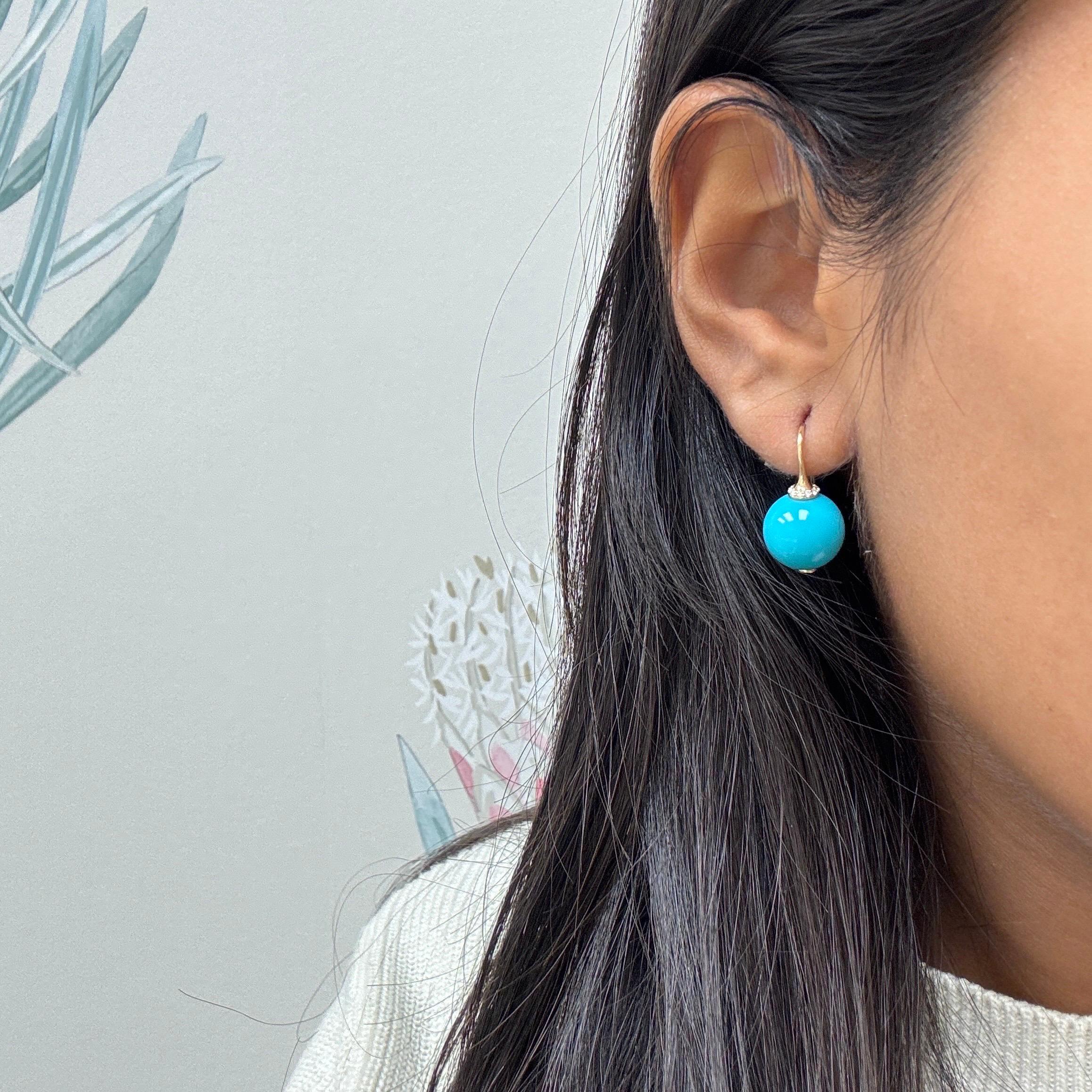 Created in 18 karat yellow gold
Sleeping Beauty Turquoise beads 23 carats
Diamonds 0.10 carat approx.
Limited edition

These luxurious Candy Blue Topaz and Moon Quartz Earrings feature 18 karat yellow gold and Sleeping Beauty Turquoise beads with 23