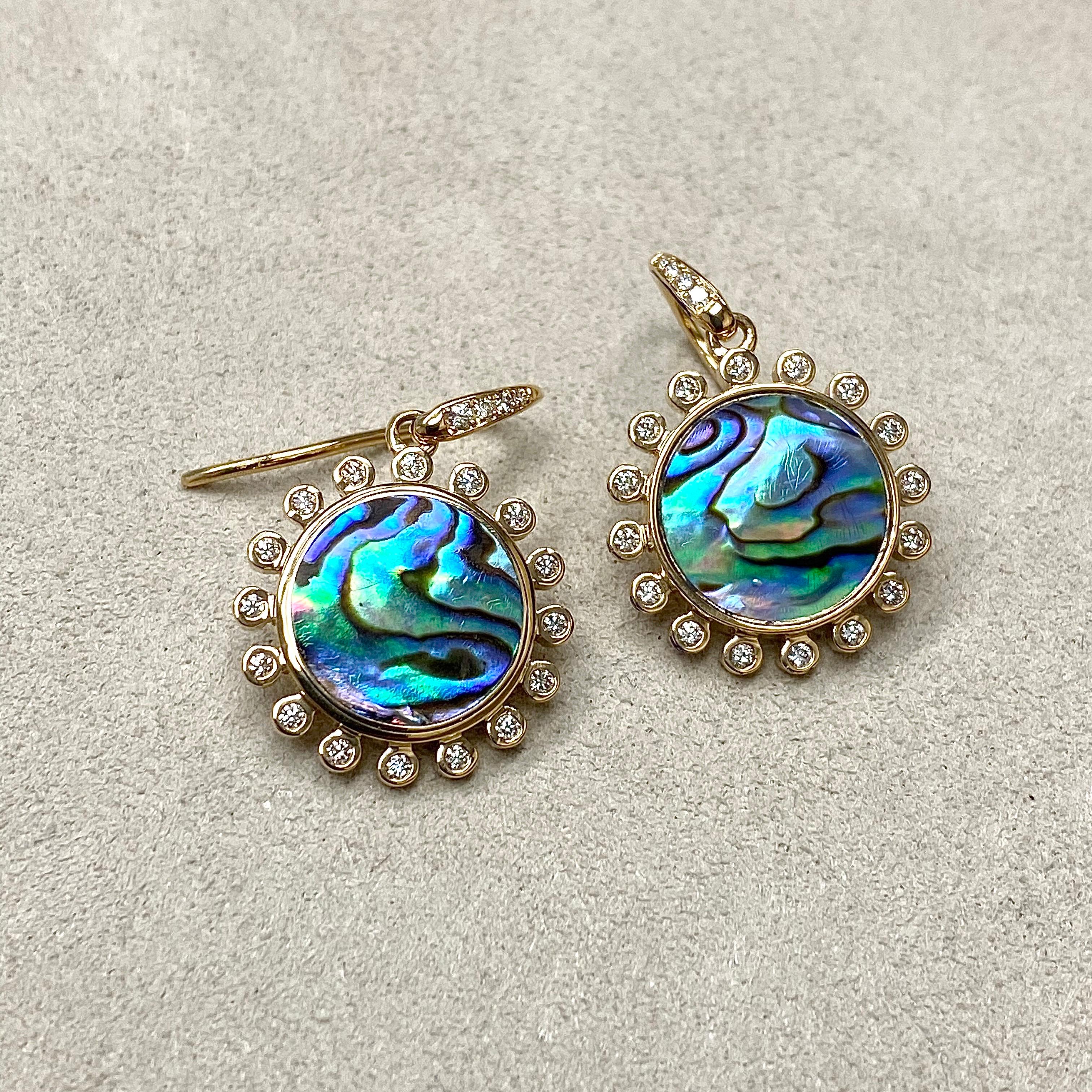 Created in 18 karat yellow gold
Abalone shell 7 cts approx
Diamonds 0.40 cts approx
Limited edition

Experience elegance and exclusivity with these exquisitely crafted Candy Blue Topaz and Diamond Earrings. Embellished with 7 cts of Abalone shell