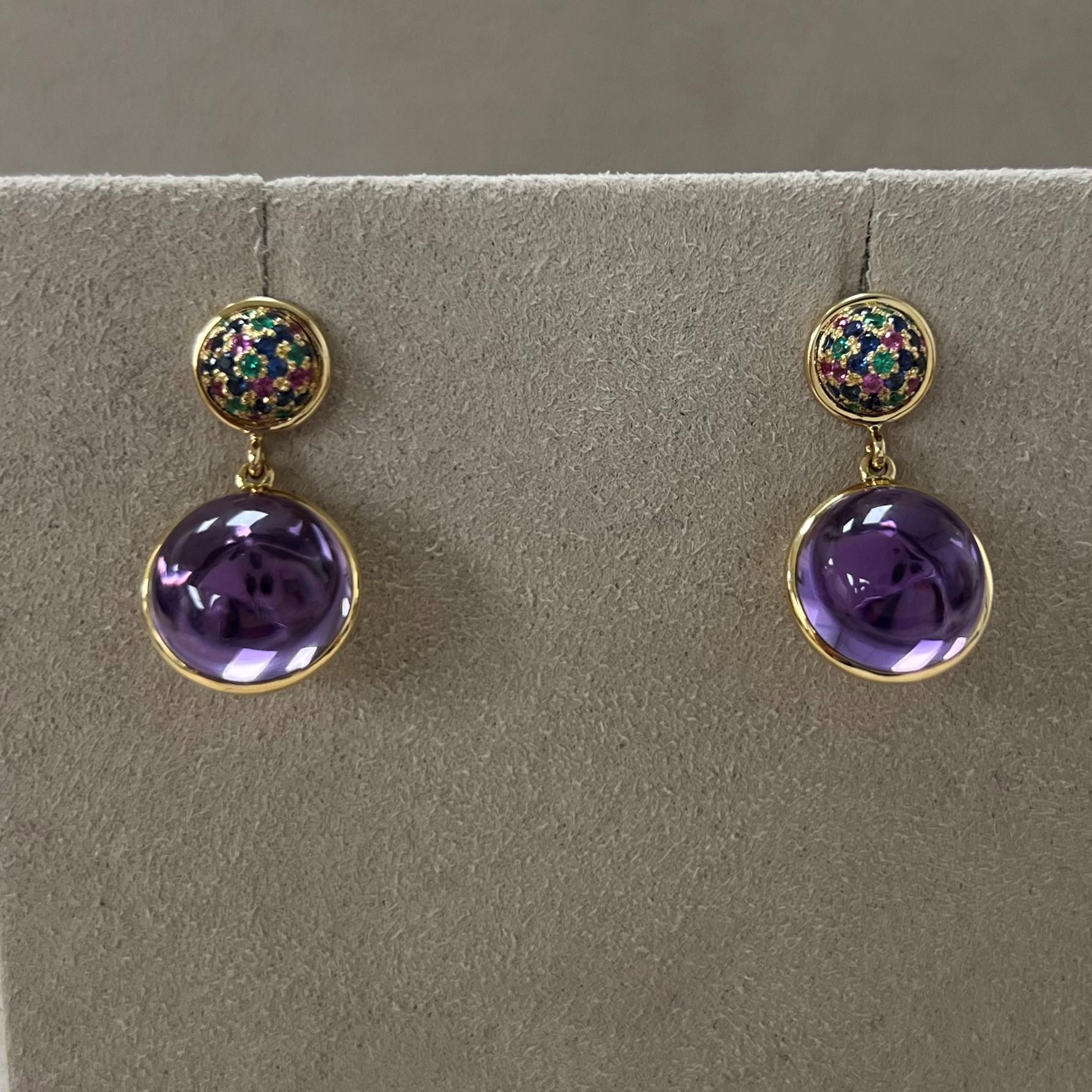 Created in 18 karat yellow gold
Amethyst 10 carats approx.
Emeralds 0.10 carat approx.
Rubies 0.30 carat approx.
Sapphires 0.18 carat approx.
Post back for pierced ears


About the Designers ~ Dharmesh & Namrata

Drawing inspiration from little