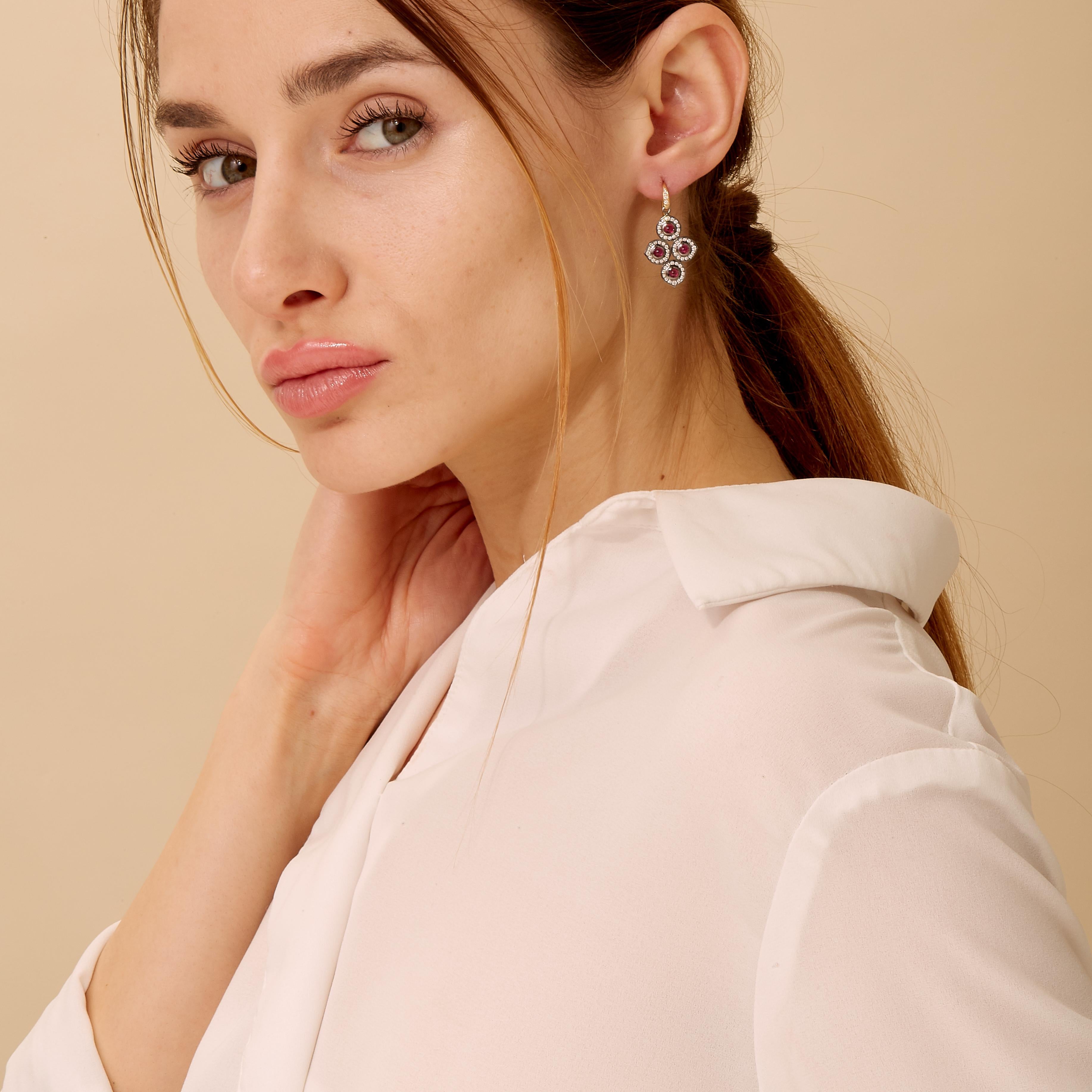 Created in 18kyg & oxidized silver 
Rubies 1.30 carats approx.
Diamonds 0.80 carats approx.
French wire for pierced ears

Experience luxury and elegance with these magnificent Candy Blue Topaz and Moon Quartz Earrings, crafted with 18kyg and