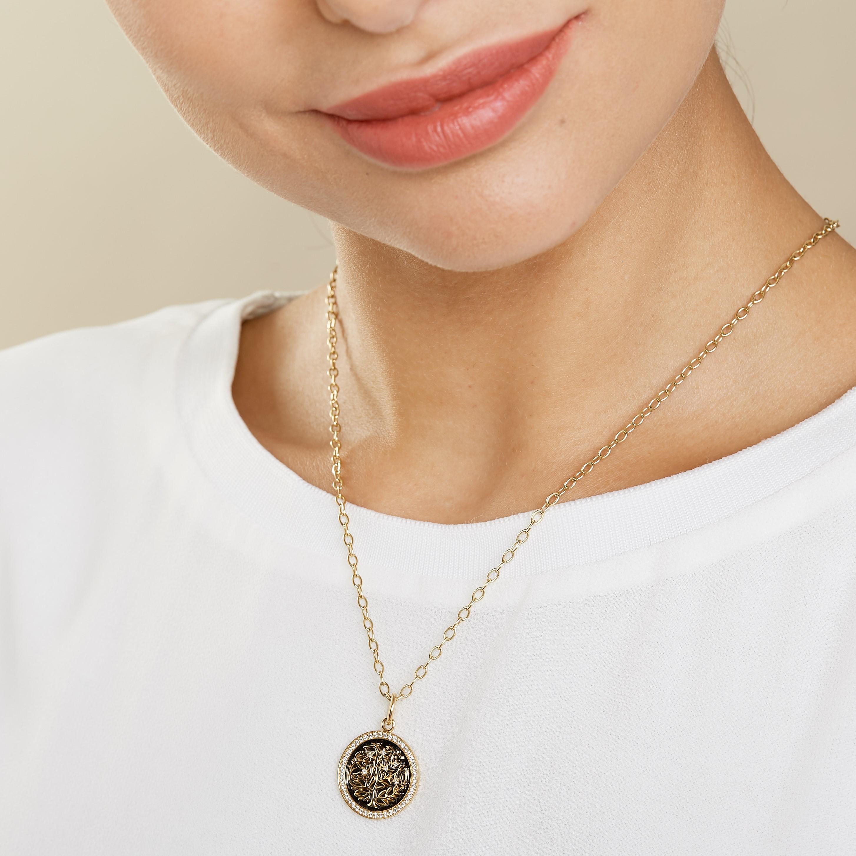 Created in 18kyg
Diamonds 0.30 cts approx
Oxidized silver base plate for contrast
Inspired from Kalpataru, the wish-fulfilling divine tree
Medallion size 20 mm
Limited edition
Chain sold separately 

Crafted with 18 karat yellow gold, this limited