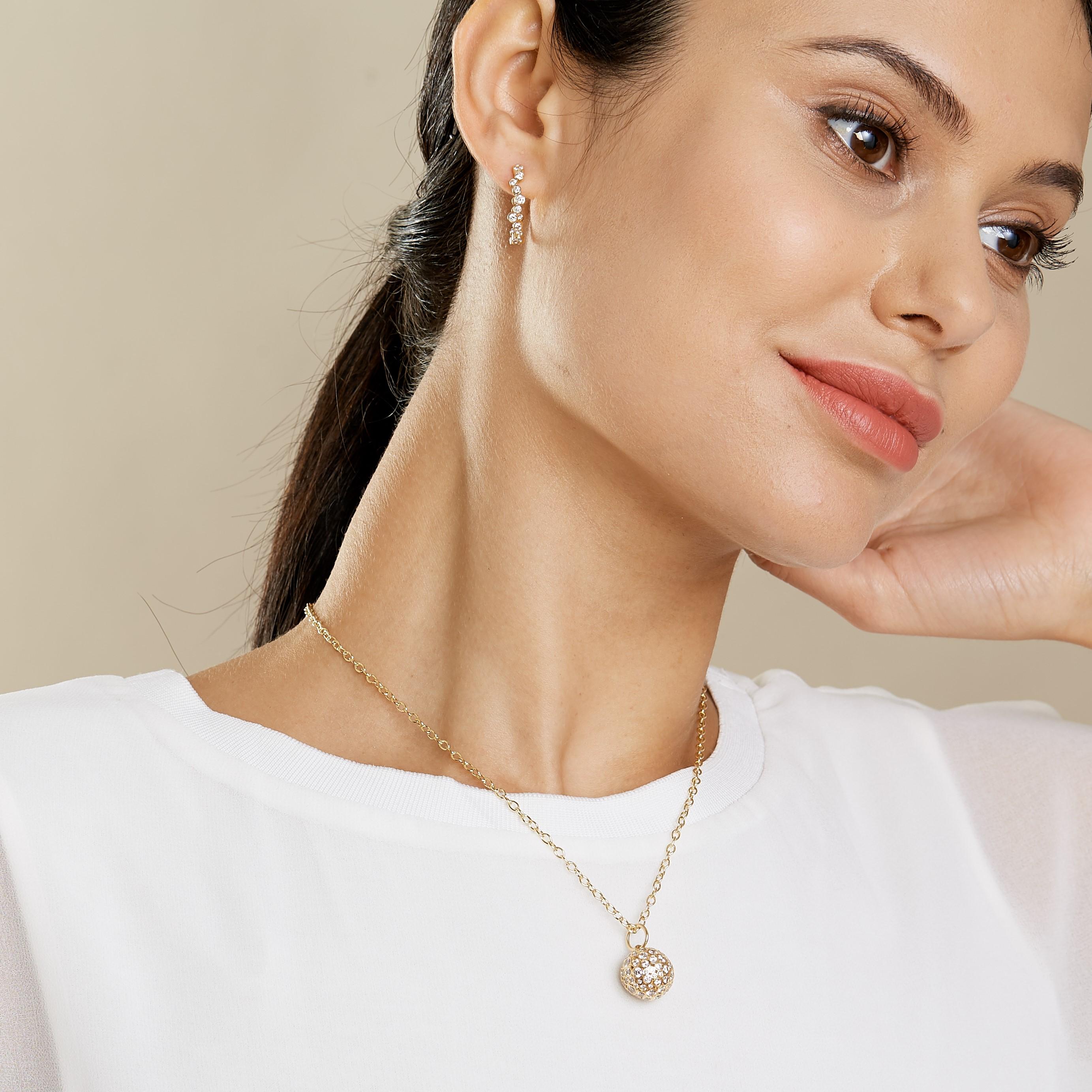 Created in 18 karat Yellow Gold
Diamonds 3cts approx
Ball Pendant with diamond set in Each bezel
Intricate workmanship
Chain sold separately
Limited edition

Intricately crafted from 18 karat Yellow Gold, this limited edition ball pendant is a
