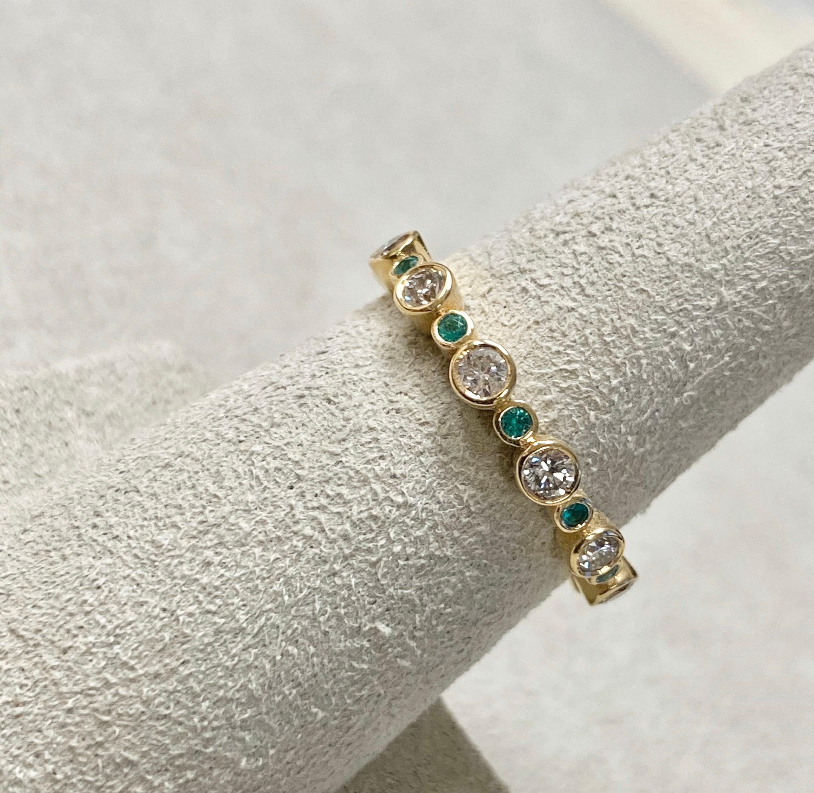 Created in 18 karat yellow gold
Diamonds 0.50 ct approx
Emeralds 0.15 cts approx
Ring size US 6.5, Can be made in other ring sizes on special order

Elegantly crafted in 18 karat yellow gold, this ring is adorned with 0.50 carats of diamonds and
