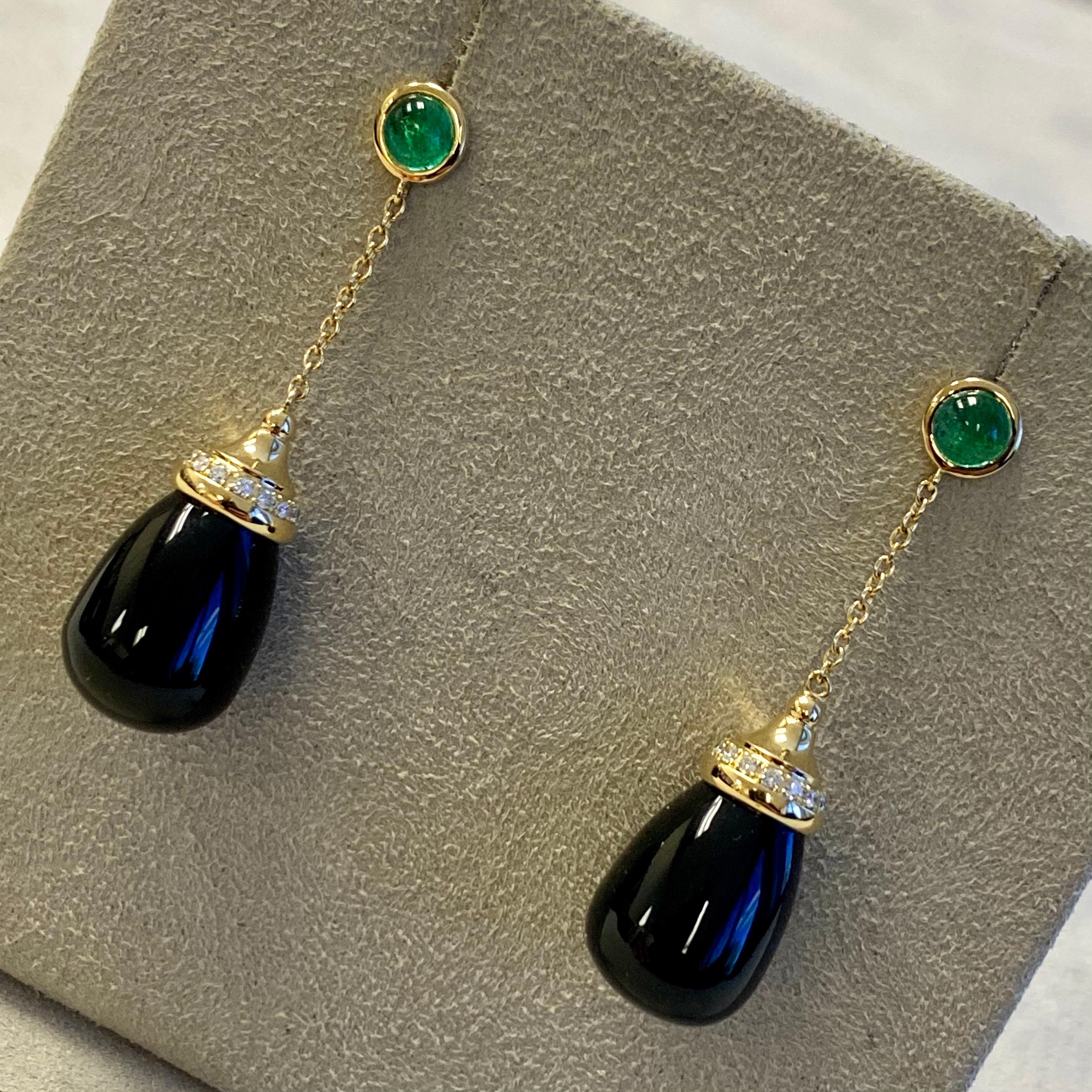 Created in 18 karat yellow gold
Black Onyx Drops 20 carats approx.
Emerald cabochons 0.50 carat approx.
Diamonds 0.10 carat approx.
18kyg butterfly backs

Exquisitely crafted in 18 karat yellow gold, these earrings boast Black Onyx Drops of