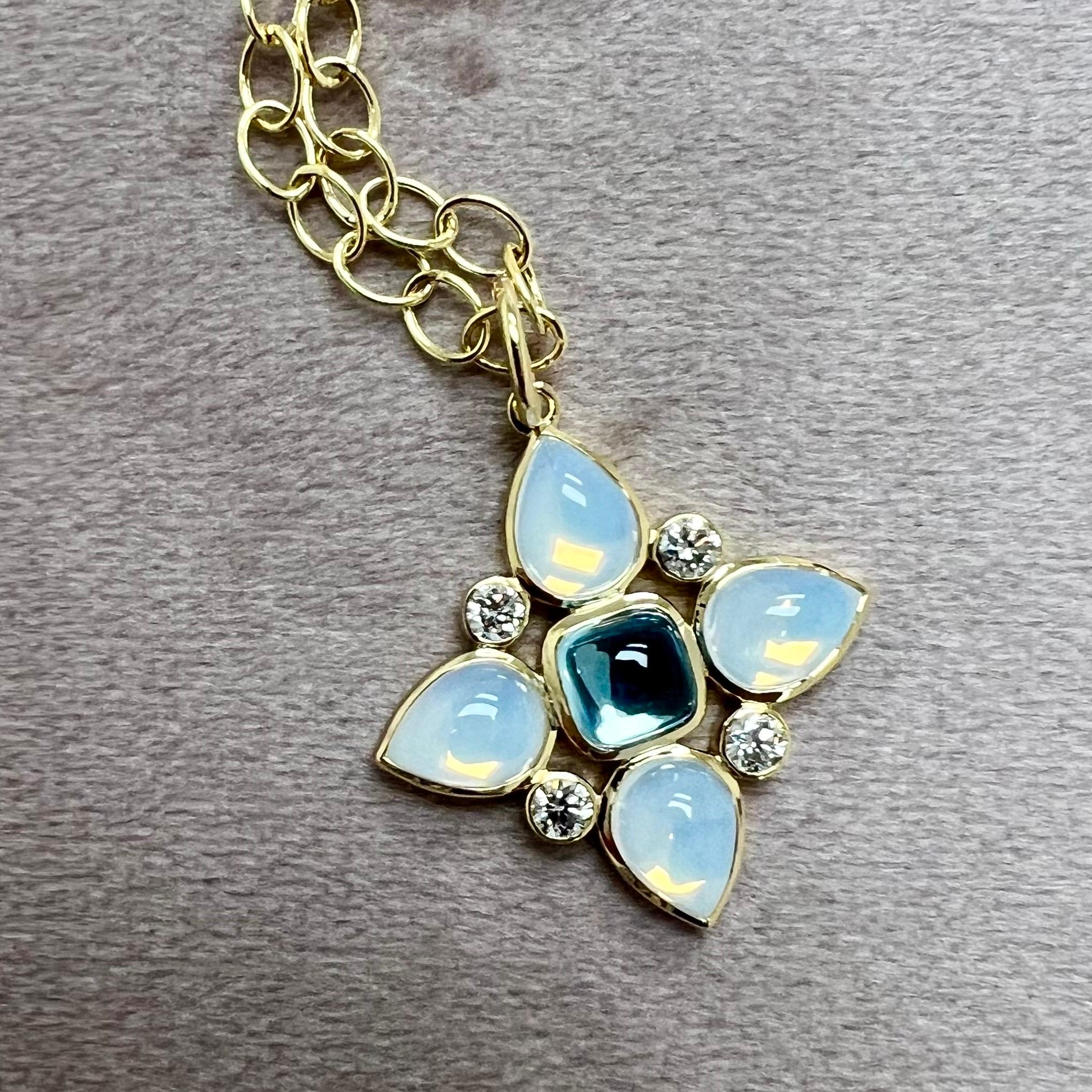 Created in 18 karat yellow gold
Blue Topaz 1.50 carats approx.
Moon Quartz 4.50 carats approx.
Diamonds 0.45 carat approx.
Chain sold separately

Enrobing 18 karat yellow gold, a blue topaz of 1.50 carats, moon quartz of 4.50 carats, and Diamonds of