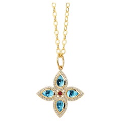 Pendentif Syna en or jaune, topaze bleue et rubis avec diamants