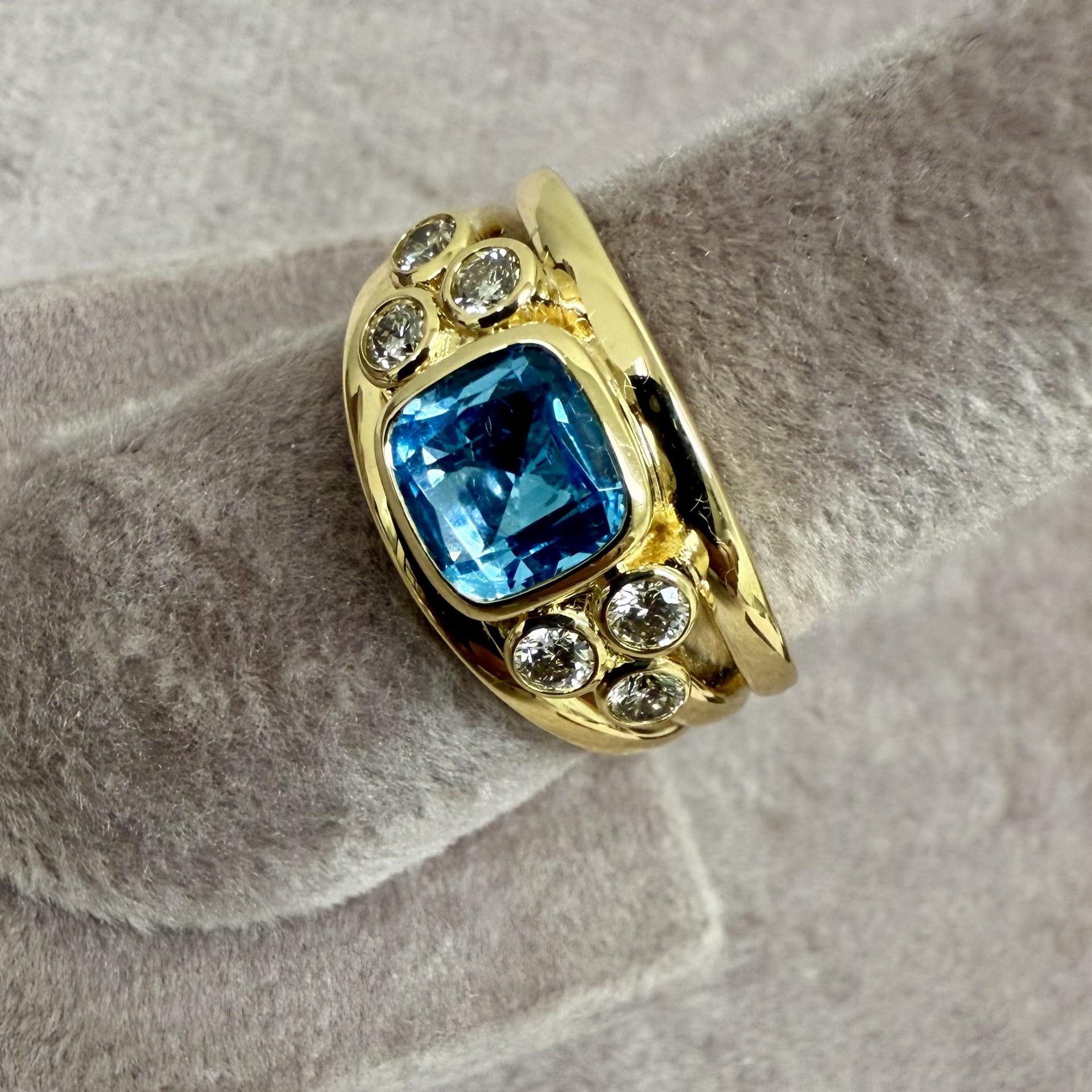 Contemporary Syna Yellow Gold Blue Topaz Band with Diamonds For Sale
