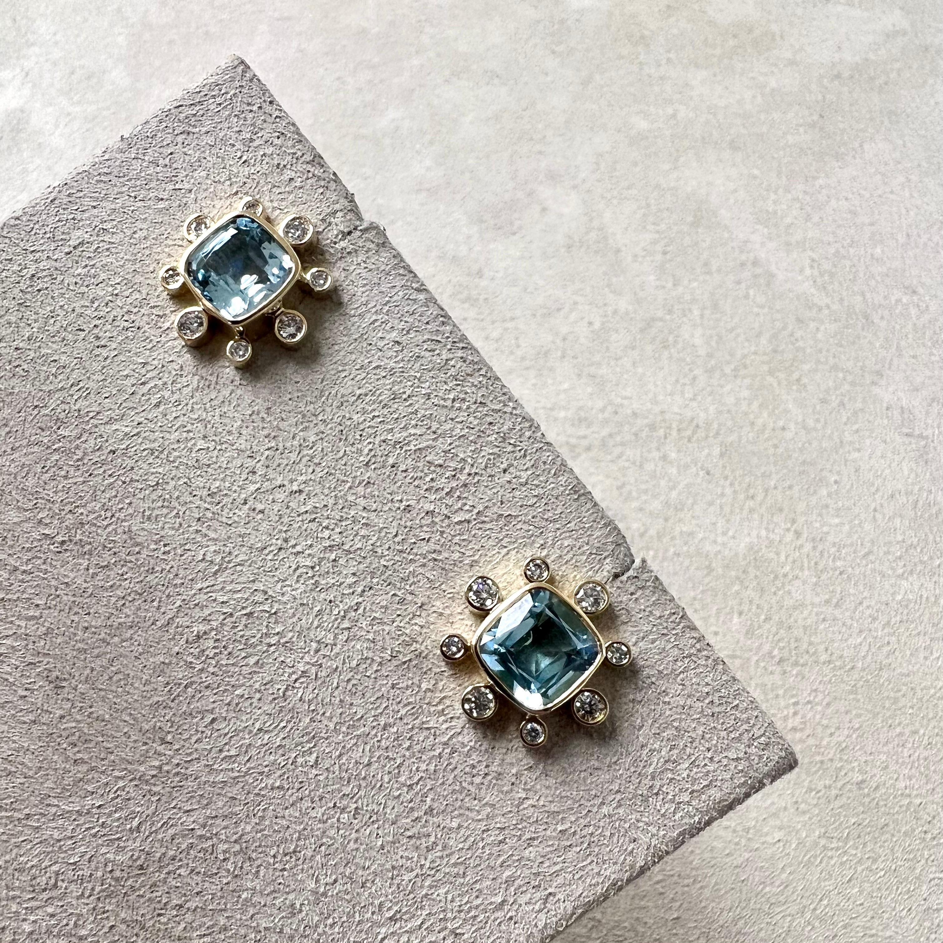 Created in 18 karat yellow gold
Blue topaz 3.30 carats approx.
Diamonds 0.35 carat approx.
18kyg butterfly backs for pierced ears
Limited edition

Exquisitely crafted in lustrous 18 karat yellow gold, this limited edition adornment showcases a