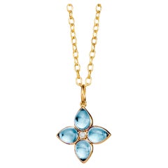 Syna Yellow Gold Blue Topaz Flower Pendant with Diamond