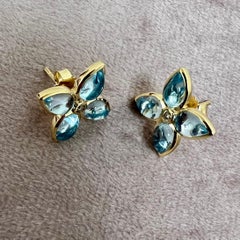 Syna Yellow Gold Blue Topaz Flower Studs with Diamonds