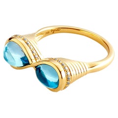 Syna Yellow Gold Blue Topaz Infinity Ring with Champagne Diamonds